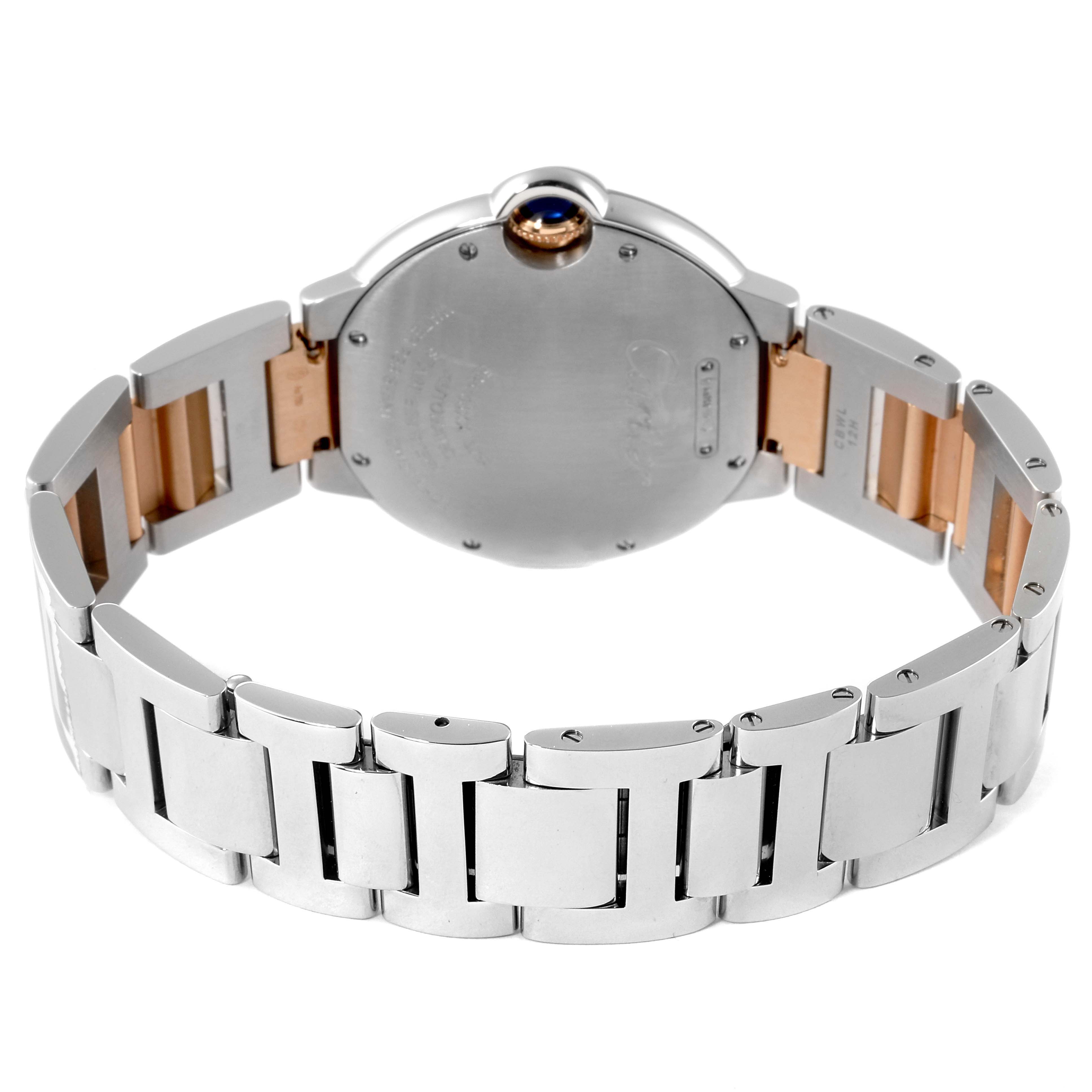 The image shows the back of the Cartier Ballon Bleu W3BB0004 Women's Steel and Gold (two tone) Silver Dial W3BB0004 Women's Steel and Gold (two tone) Silver Dial watch, highlighting its stainless steel and gold strap with a partially visible crown.