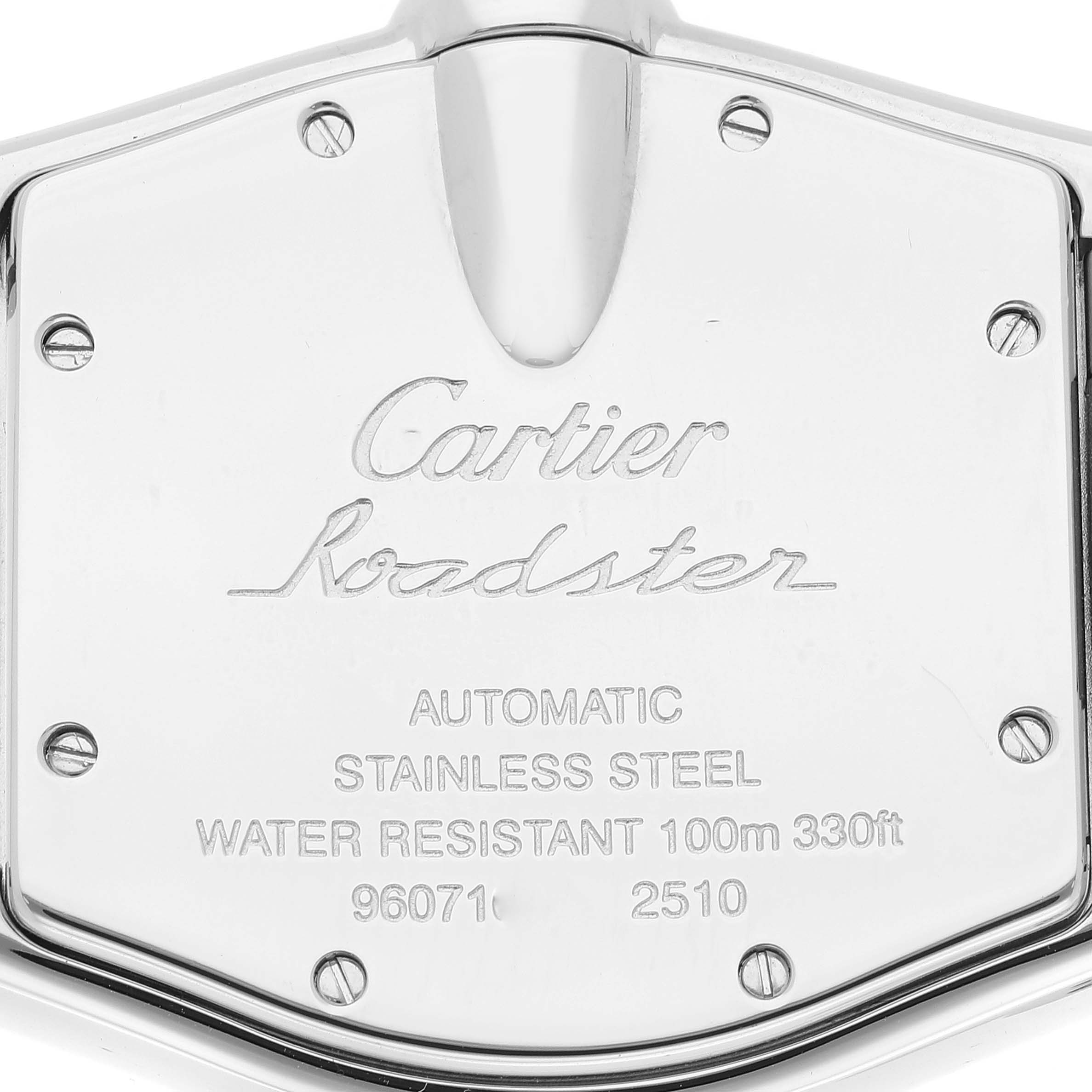 This image shows the rear case of a Cartier Roadster W62025V3 Men
s Stainless Steel Silver Dial W62025V3 Men
s Stainless Steel Silver Dial watch, displaying engraved details and screws.