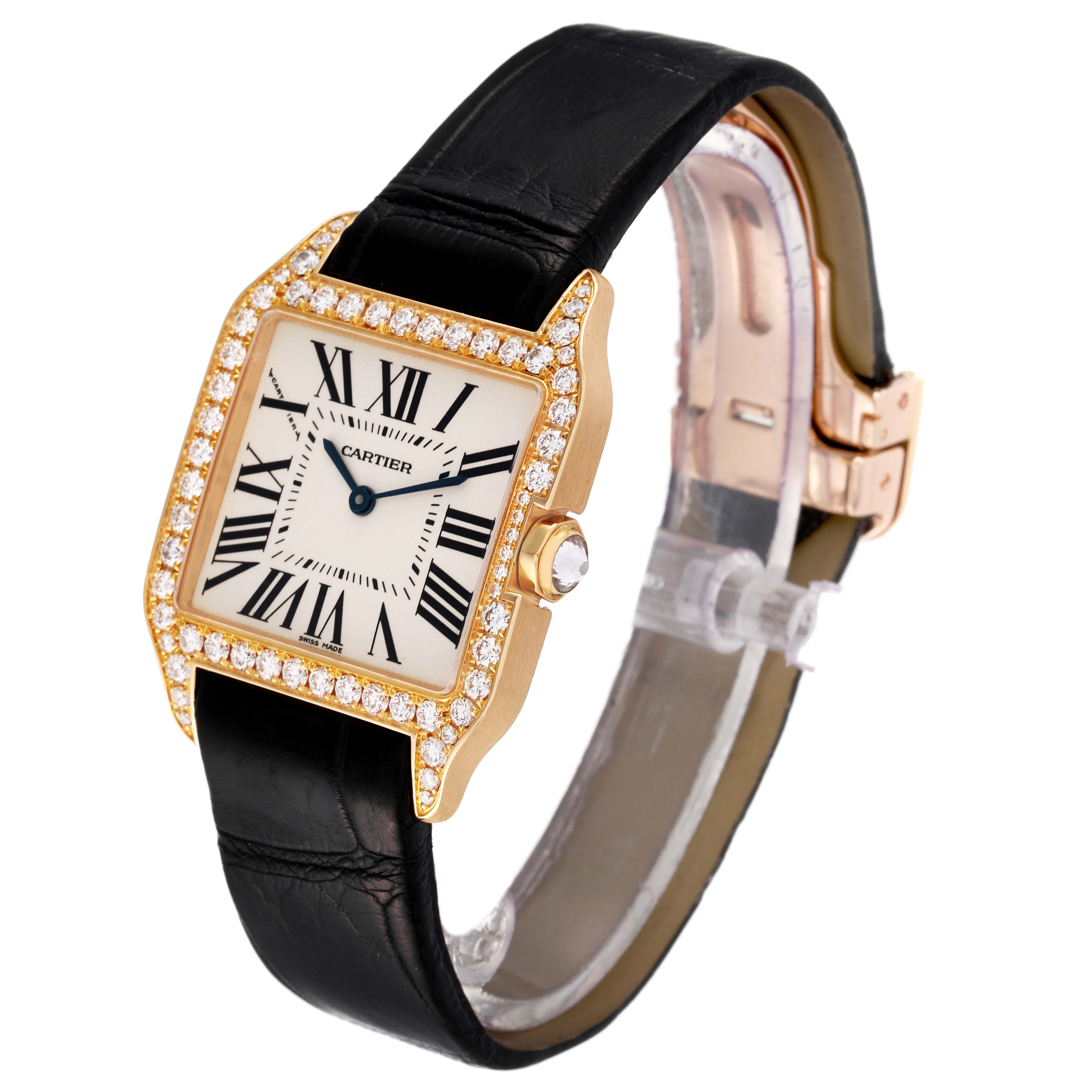 The Cartier Santos Dumont WH100351 Men's Yellow Gold Silver Dial WH100351 Men's Yellow Gold Silver Dial watch is shown at a three-quarter angle, displaying the face, bezel, and black strap.