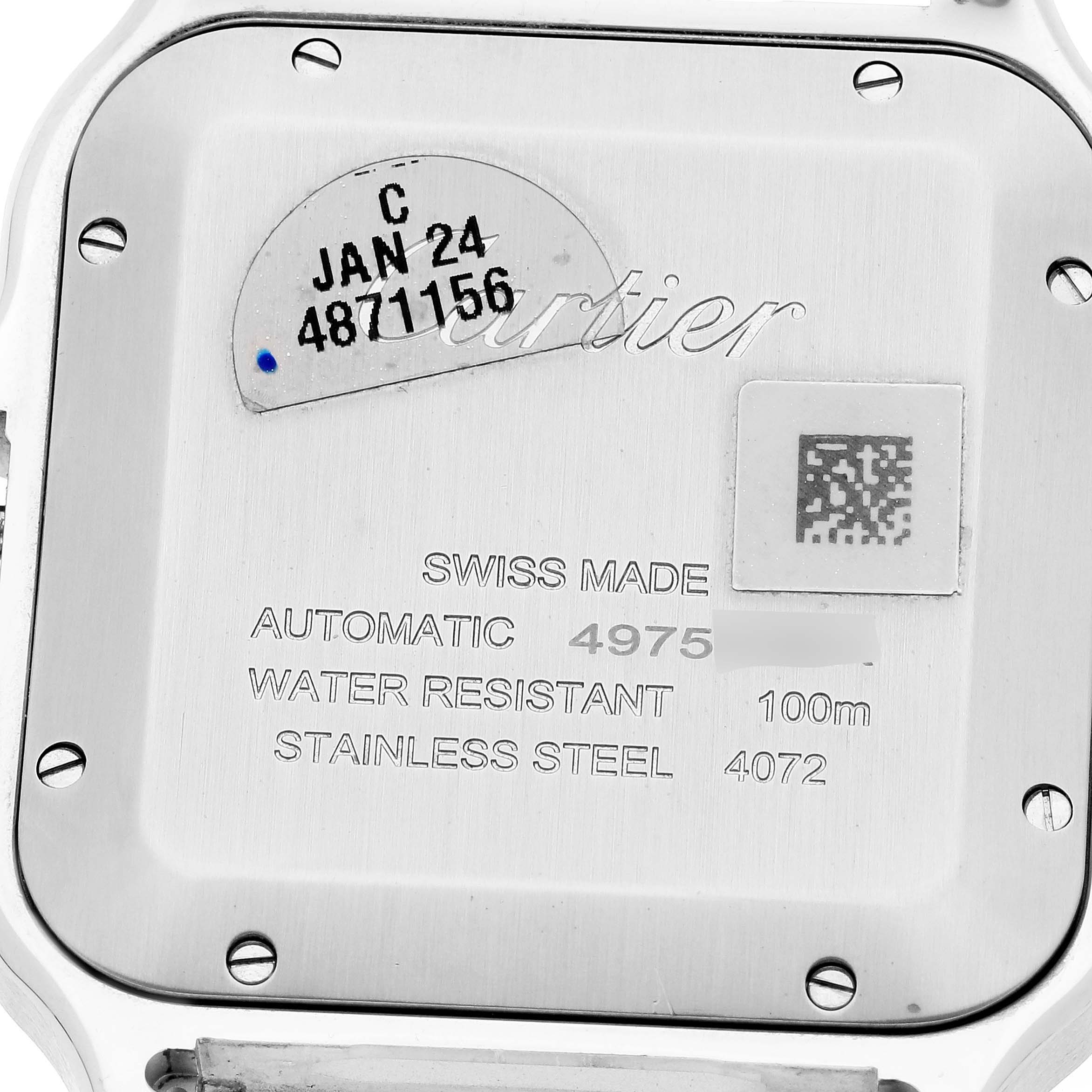 This image shows the back case of a Santos model by Cartier, displaying Swiss-made inscription and water resistance info.