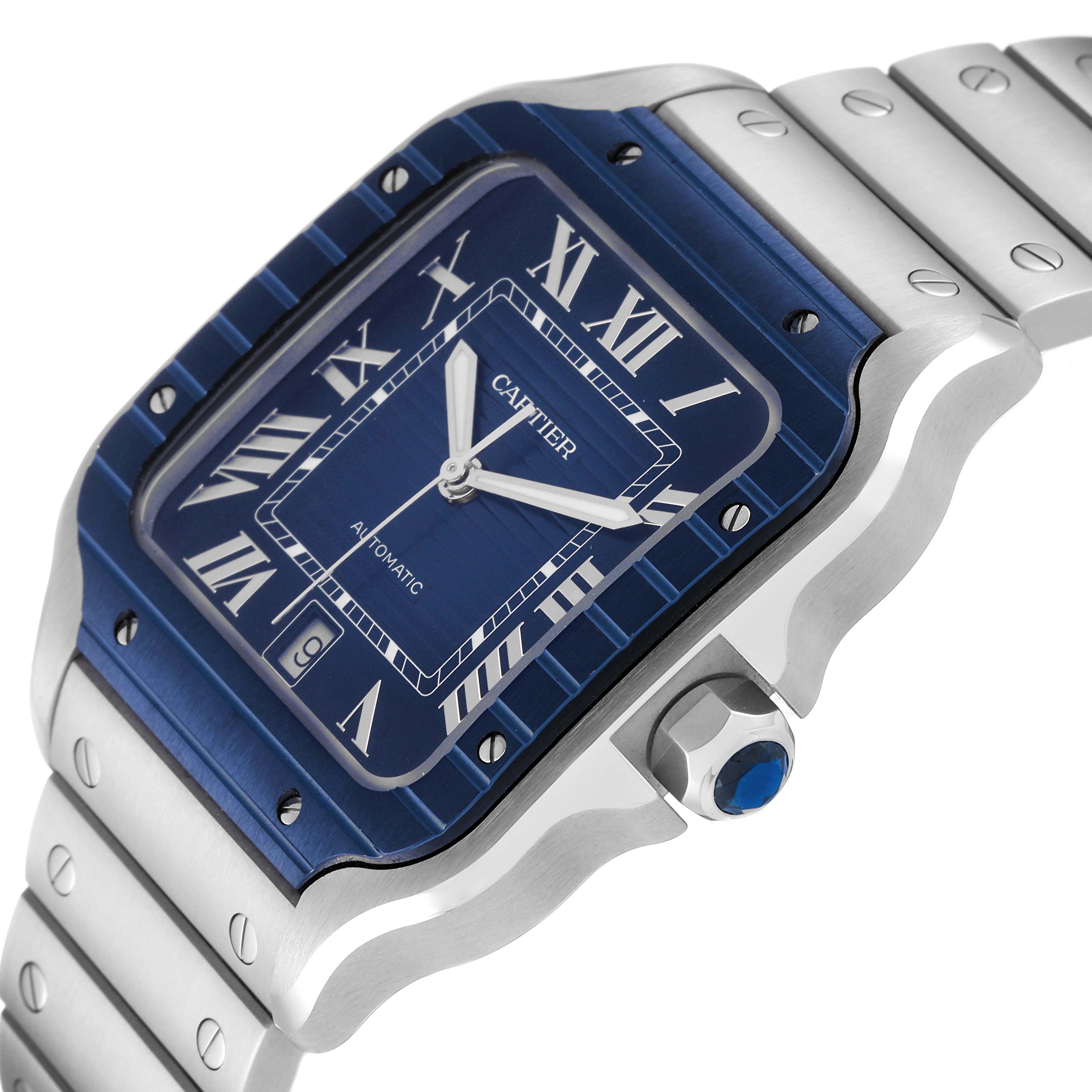 The image displays a close-up side angle of a Cartier Santos WSSA0048 Men
s Stainless Steel Blue Dial WSSA0048 Men
s Stainless Steel Blue Dial watch, highlighting its blue dial, crown, and metallic strap.