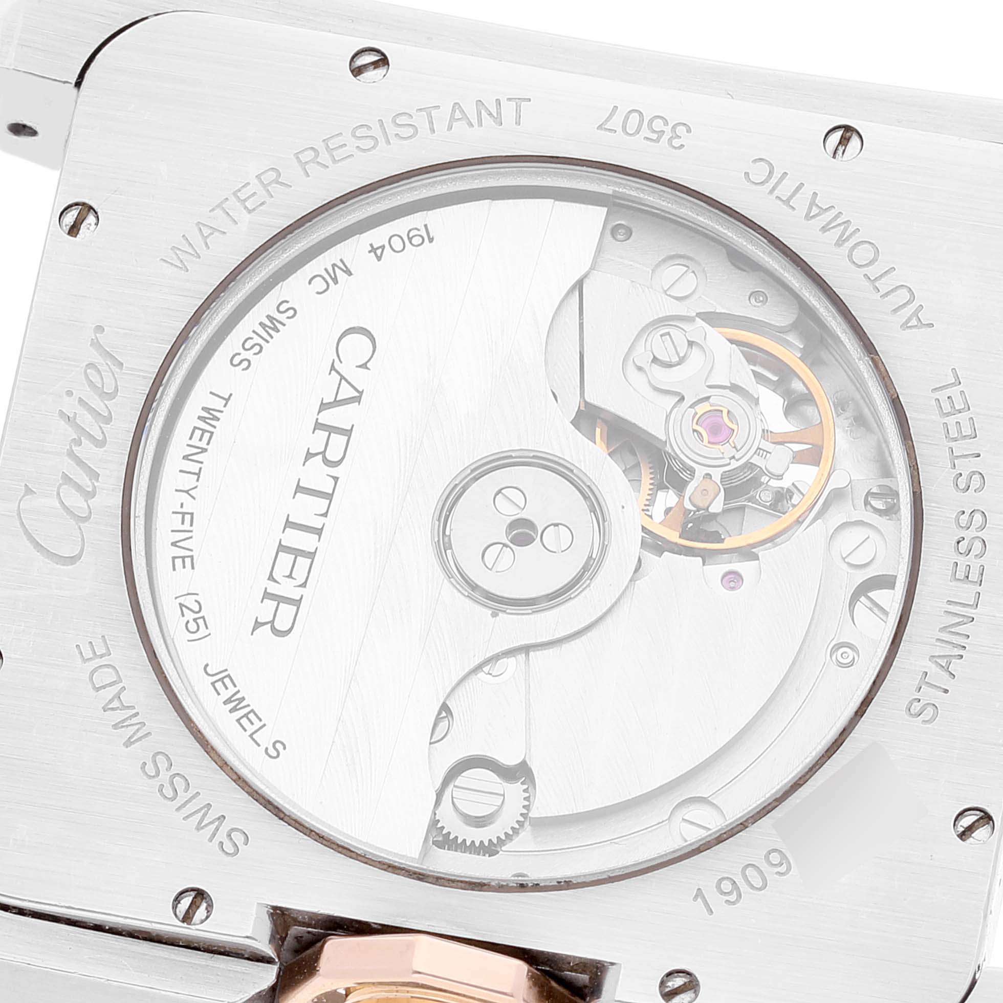 The image shows the back view of a Cartier Tank Anglaise W5310006 Men's Steel and Gold (two tone) Silver Dial W5310006 Men's Steel and Gold (two tone) Silver Dial watch, highlighting its automatic movement and internal components.