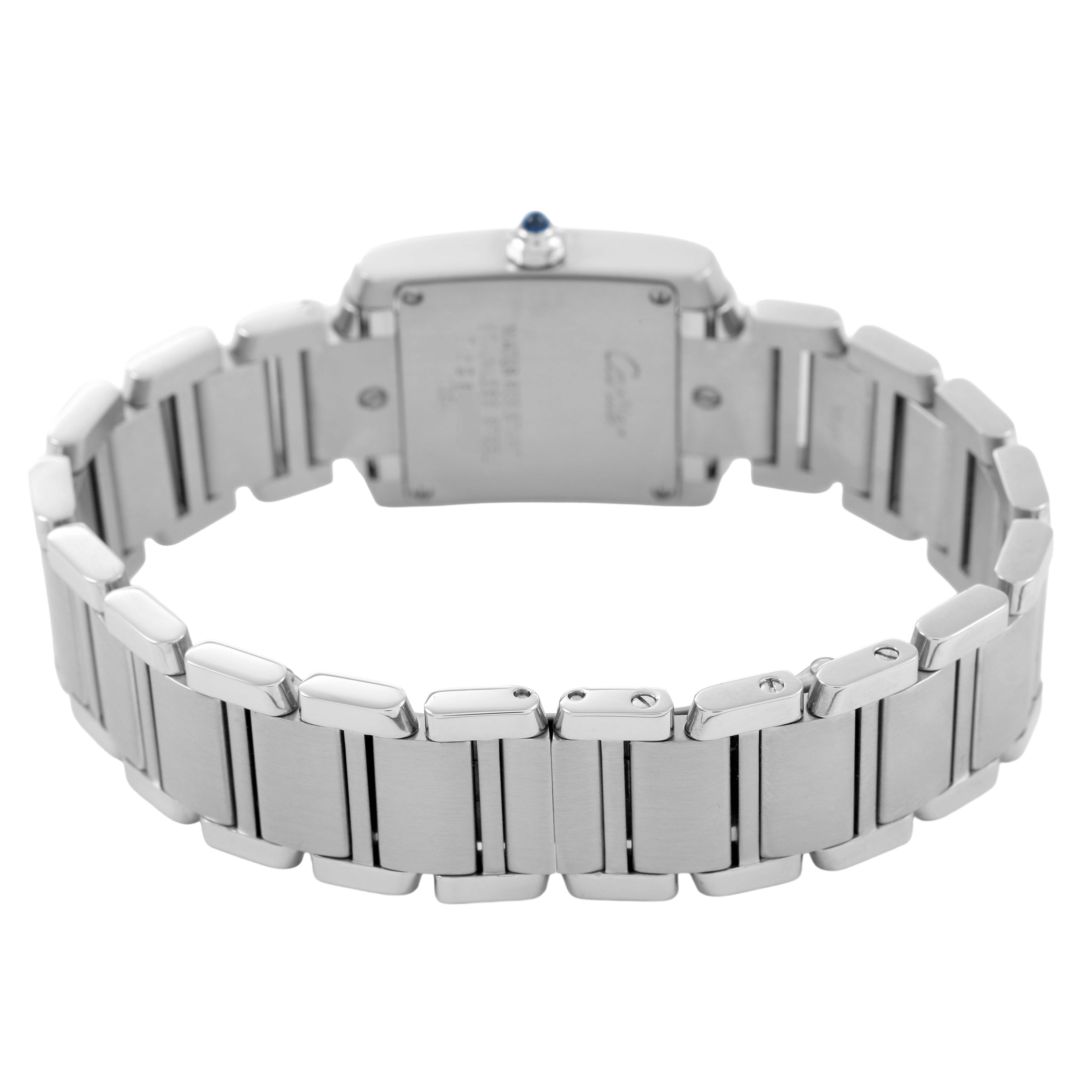 The Cartier Tank Française watch is shown from the back, highlighting its stainless steel bracelet and case back with the crown visible.