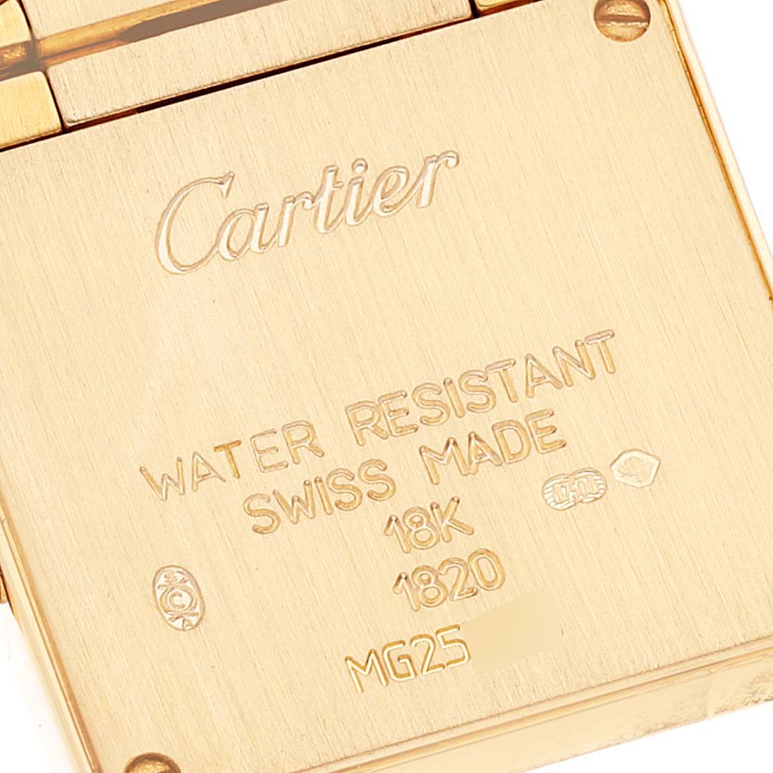 This close-up image shows the back plate of a Cartier Tank Francaise W500002N2 Women's Yellow Gold Silver Dial W500002N2 Women's Yellow Gold Silver Dial watch, highlighting the engraved details and screws.