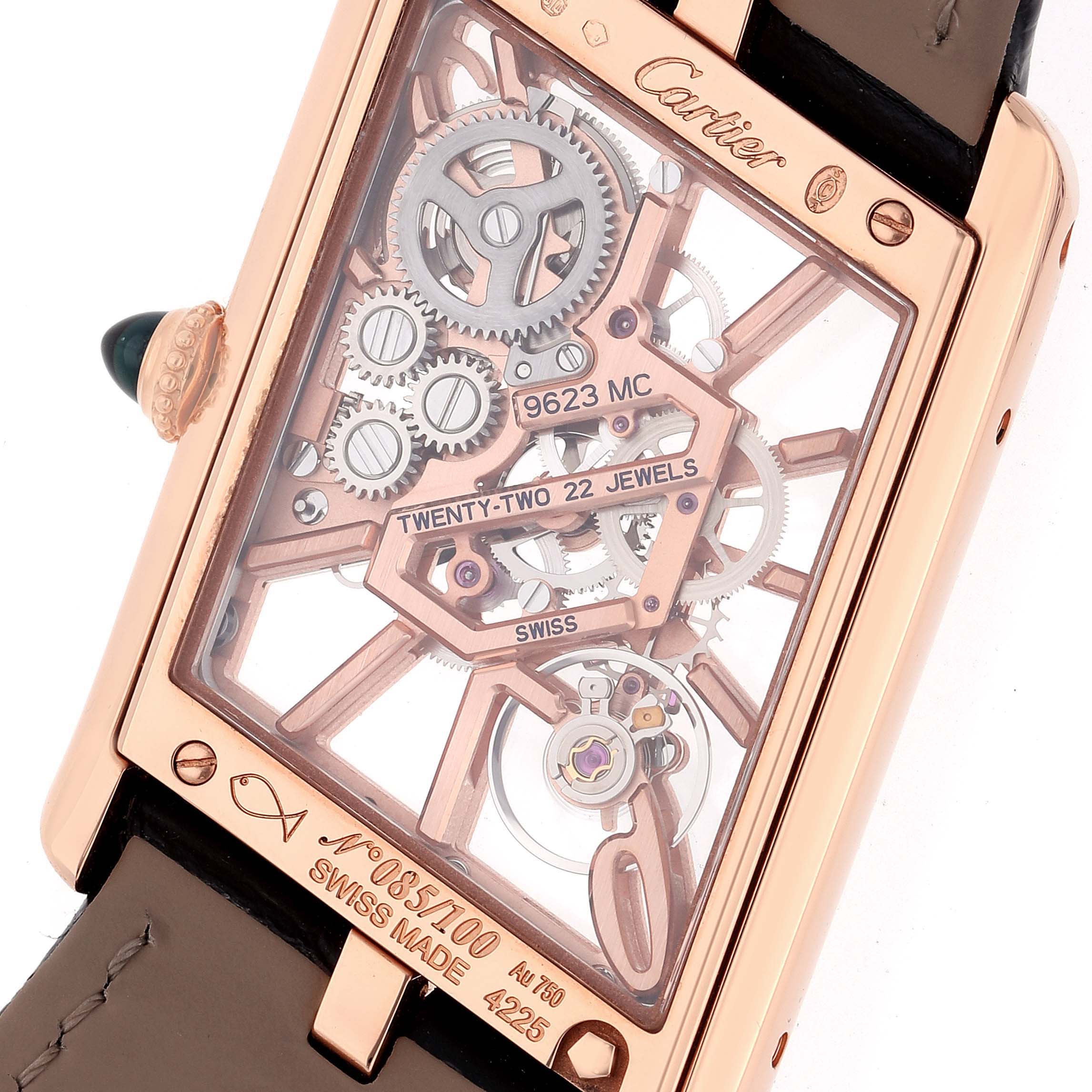 The image shows the back angle of the Cartier Tank Asymetrique WHTA0011 Men's Rose Gold Transparent Dial WHTA0011 Men's Rose Gold Transparent Dial watch, revealing its inner mechanical parts and engravings.