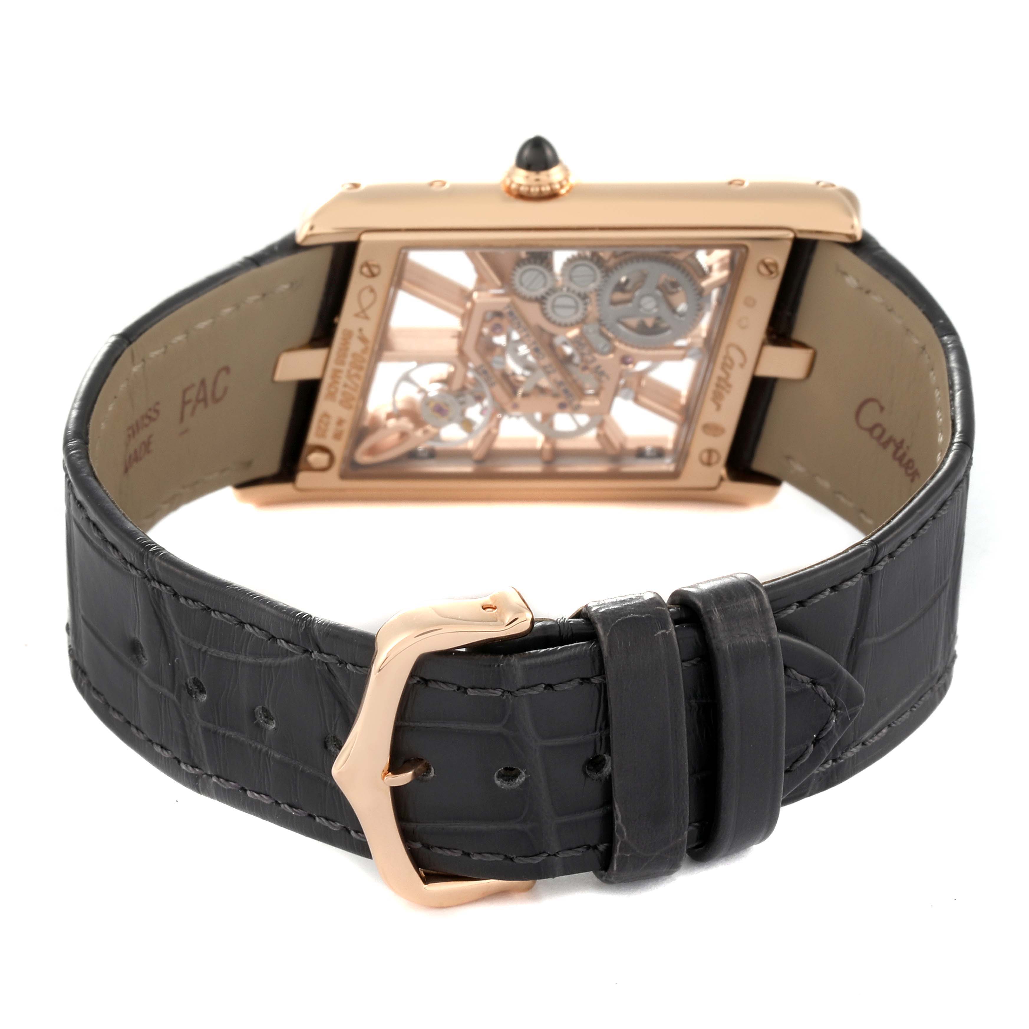The image shows the back view of the Cartier Tank Asymetrique WHTA0011 Men's Rose Gold Transparent Dial WHTA0011 Men's Rose Gold Transparent Dial watch, highlighting its skeleton movement and black leather strap.