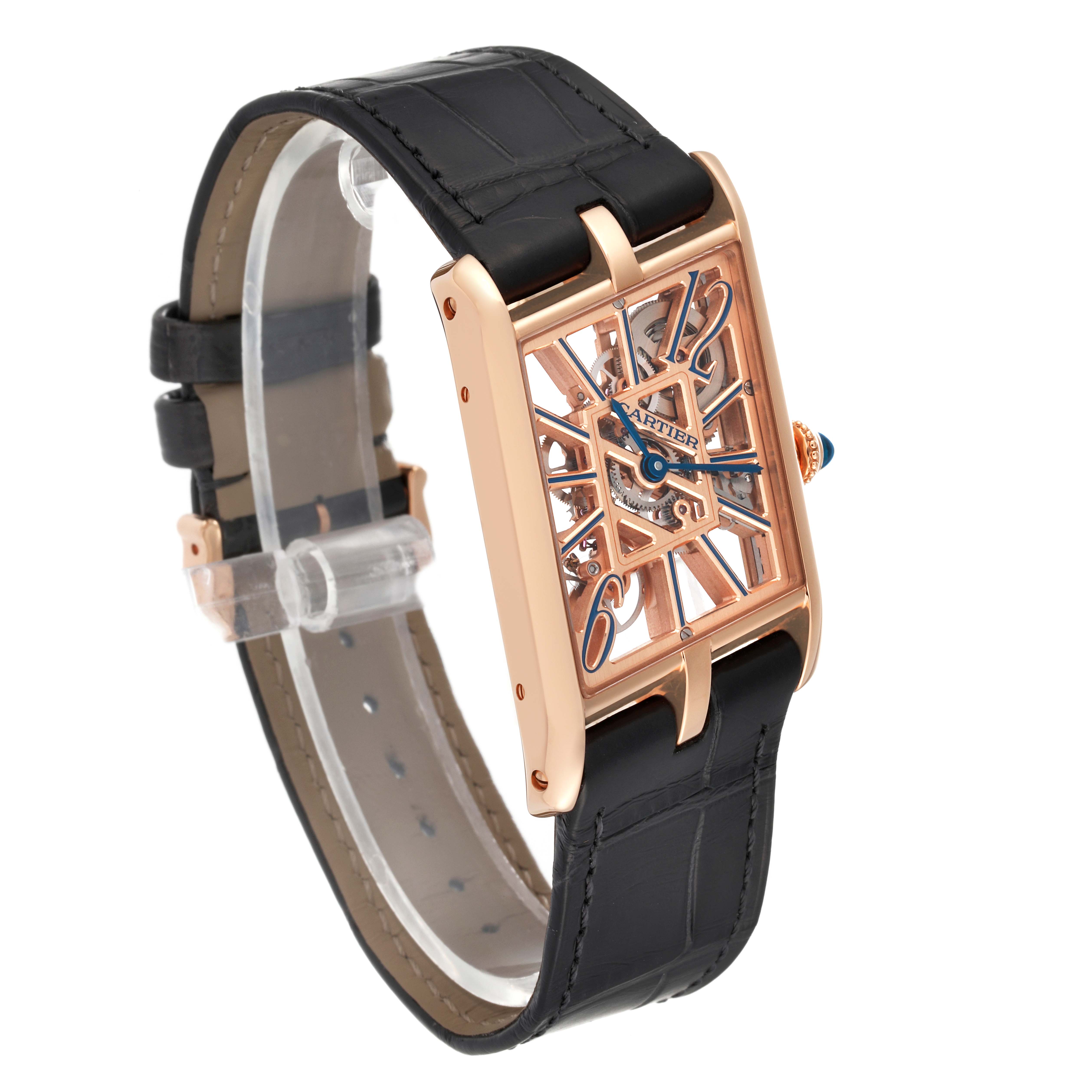 The Tank Asymetrique by Cartier is shown at an angled side view, highlighting its rose gold case, black strap, and skeleton dial.