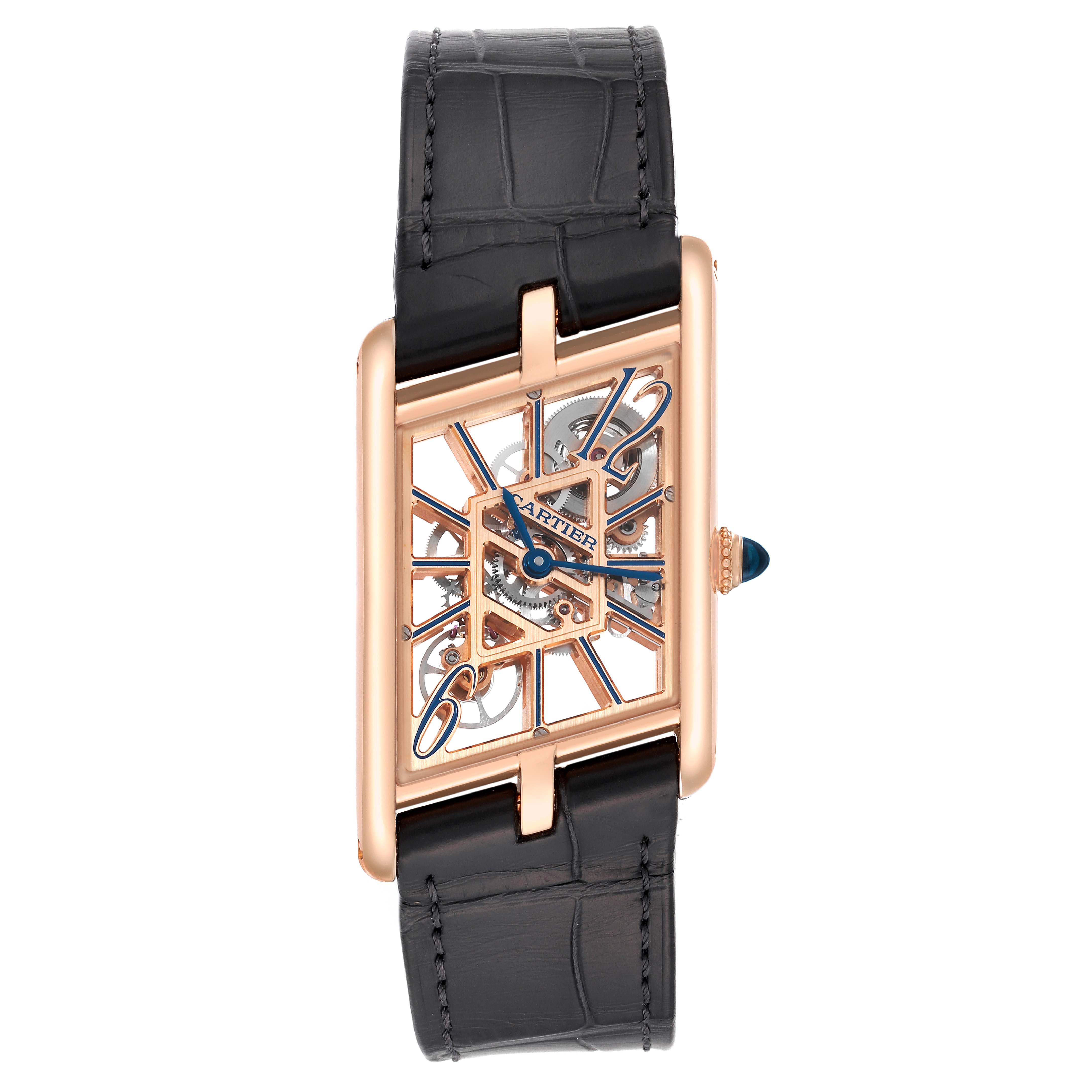 The Tank Asymétrique by Cartier is shown from a top-down angle, showcasing its rectangular case and exposed movement.