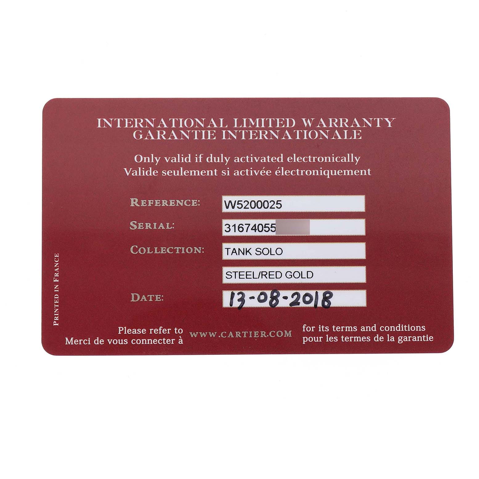 This image shows an international limited warranty card for a Cartier Tank Solo W5200025 Men's Rose Gold Silver Dial watch, detailing model and serial numbers.