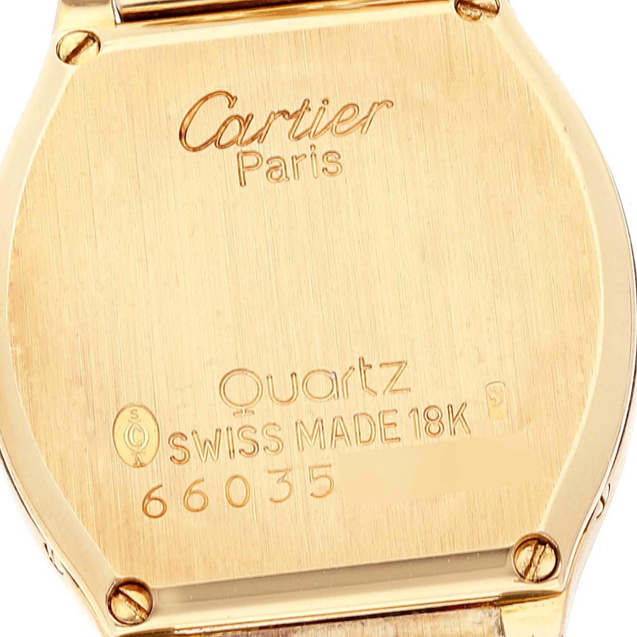 This image shows the backplate of the Cartier Tortue Women's Yellow Gold Silver Dial Women's Yellow Gold Silver Dial watch, highlighting the brand, model, and specifications.