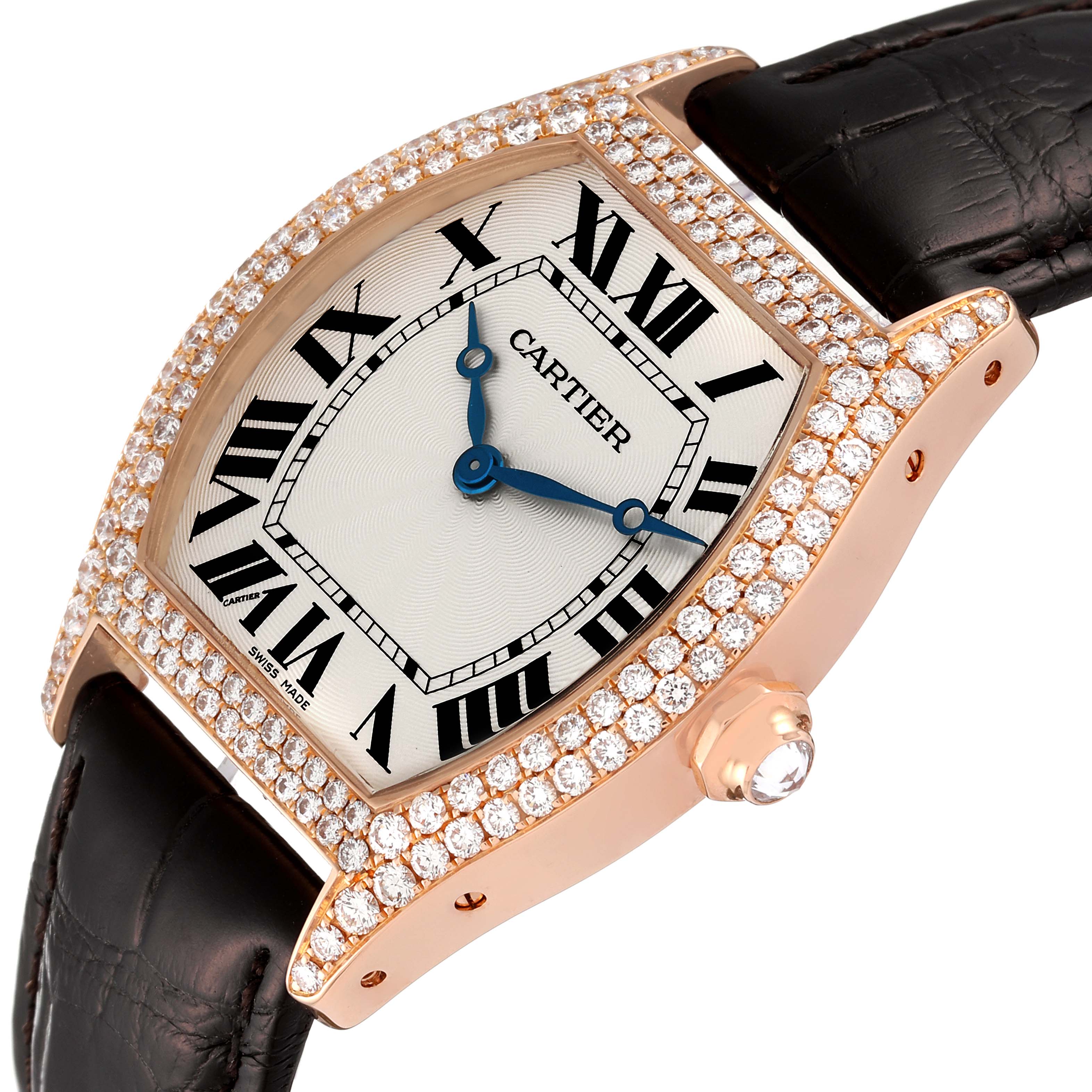 The Tortue model by Cartier is shown at an angled close-up, displaying the face, bezel, crown, and leather strap.