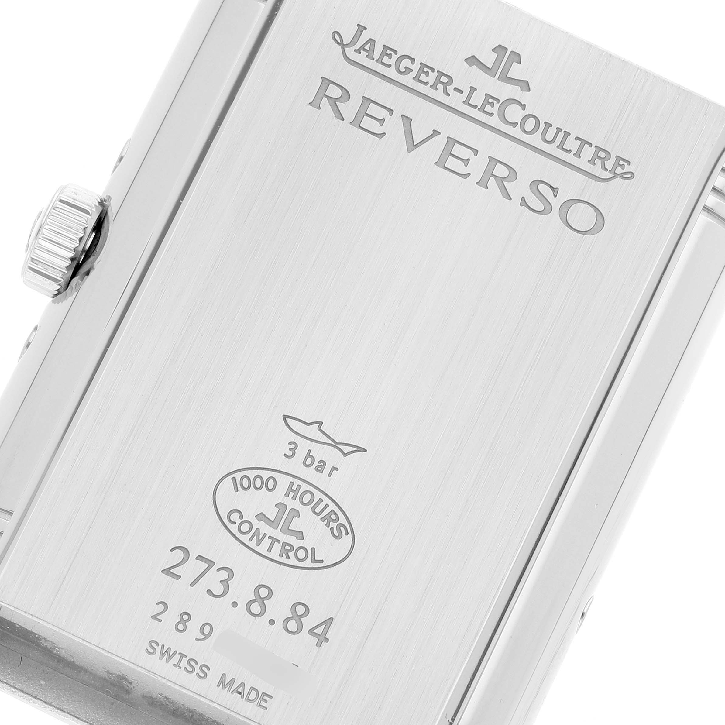 The image shows the back case of a Jaeger-LeCoultre Reverso watch, highlighting the brand, model name, and specific details.