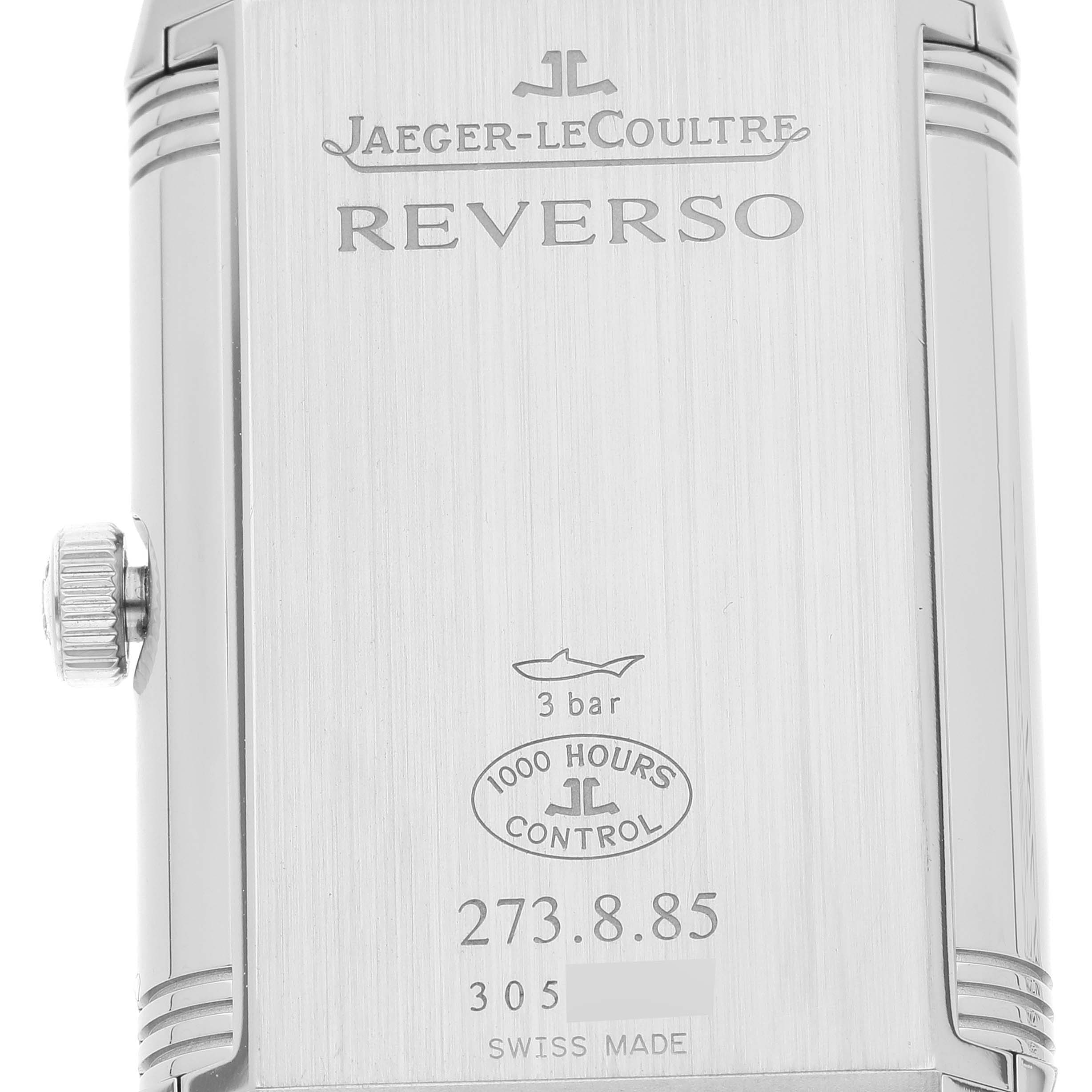 The image shows the back of a Jaeger-LeCoultre Reverso watch, highlighting the brand, model, and water resistance information.