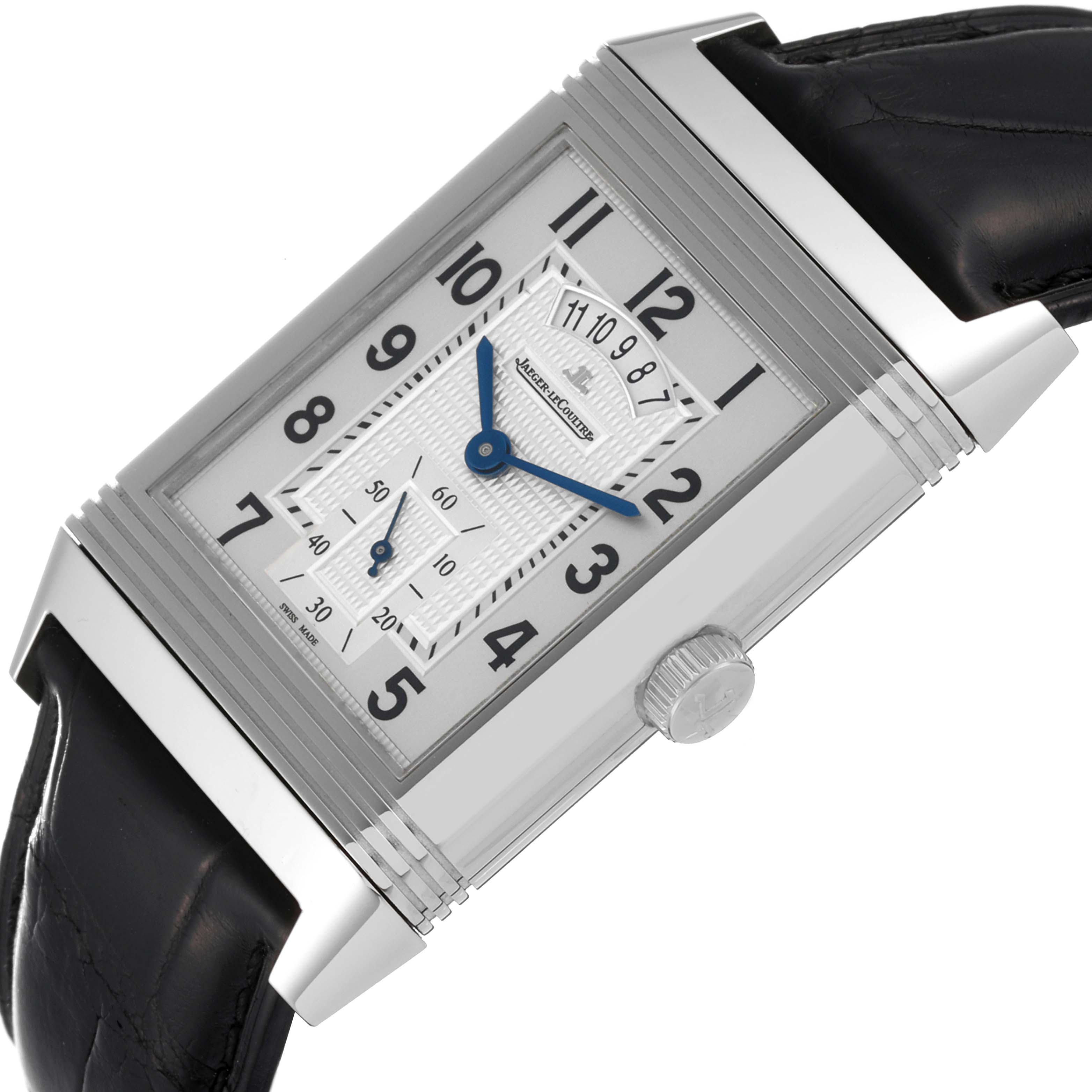 The image shows a close-up of a Jaeger-LeCoultre Reverso watch, highlighting its dial, blue hands, crown, and part of the black strap.