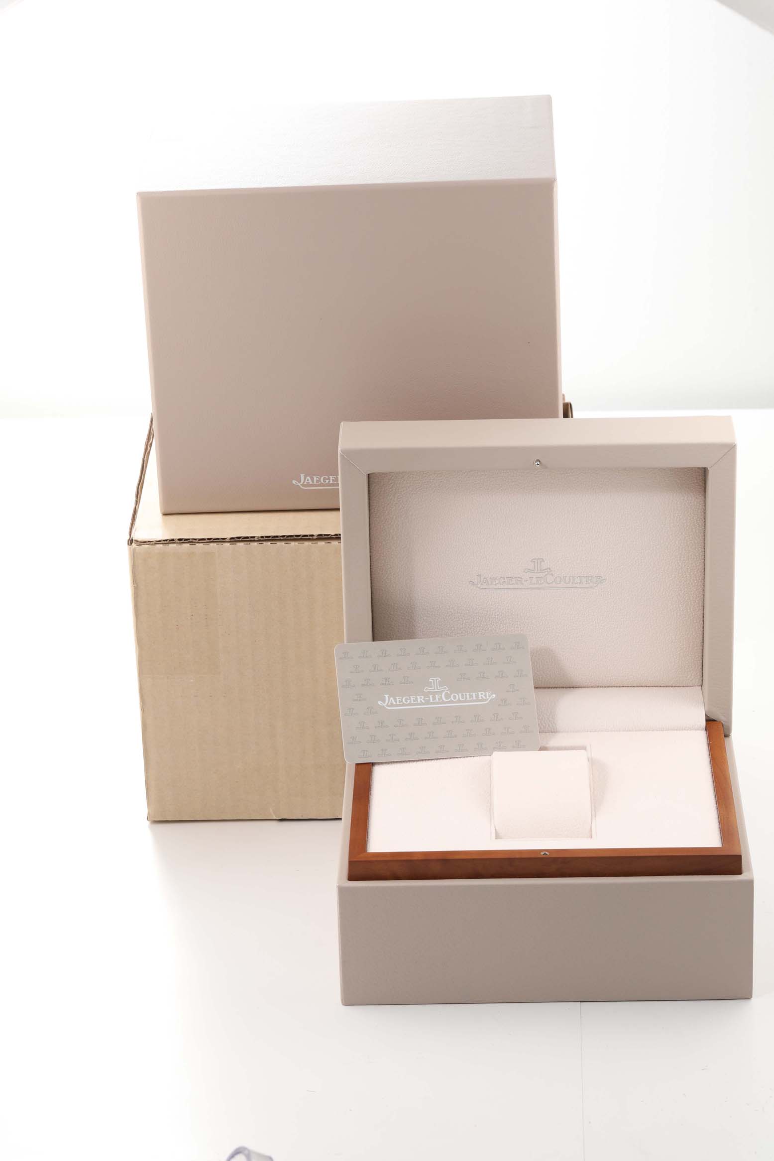 This image shows the packaging, including the box and possibly warranty card, for a Jaeger LeCoultre Master Q1558421 Men's Stainless Steel Silver Dial Q1558421 Men's Stainless Steel Silver Dial model watch.