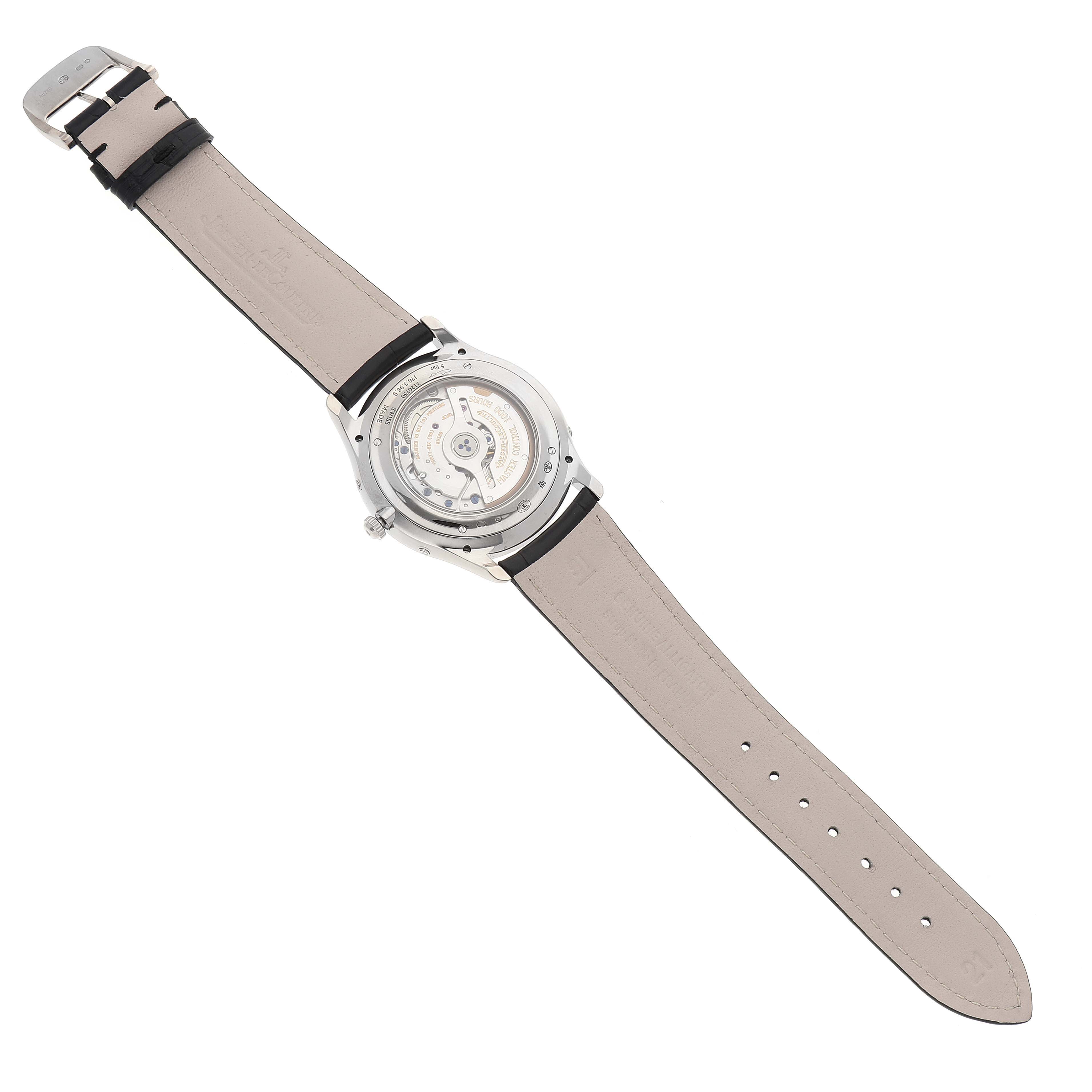 The image shows the back view of the Jaeger LeCoultre Master Q1263520 Men's White Gold Silver Dial Q1263520 Men's White Gold Silver Dial model watch, highlighting its open case back and beige leather strap.