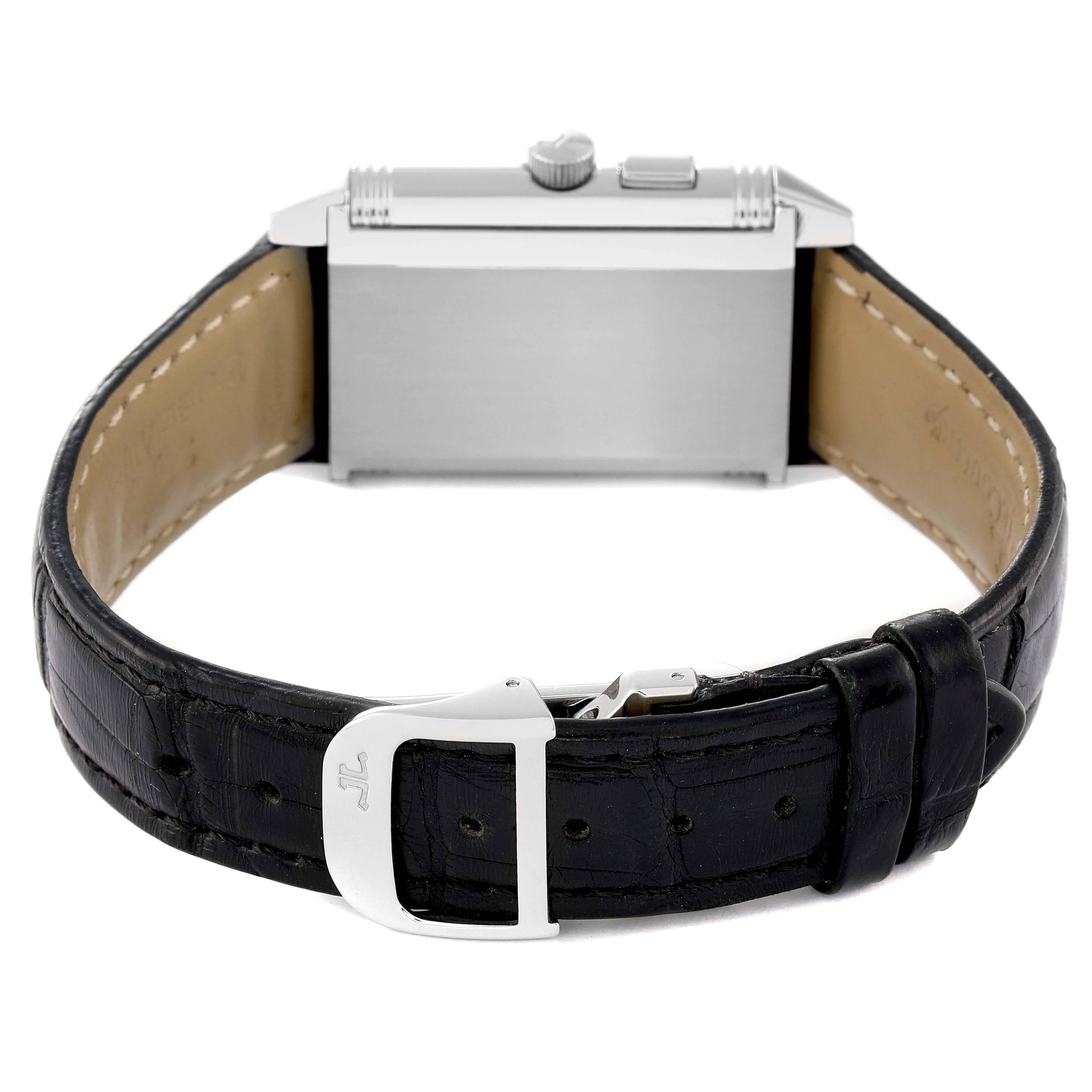 The image shows the back view of a Jaeger-LeCoultre Reverso watch, including its strap and buckle.