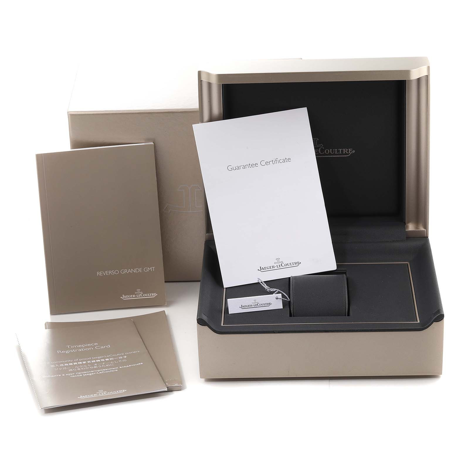 The image shows the packaging, guarantee certificate, instruction booklets, and box for the Jaeger LeCoultre Reverso Q3028420 Men's Stainless Steel Silver Dial Q3028420 Men's Stainless Steel Silver Dial model watch.