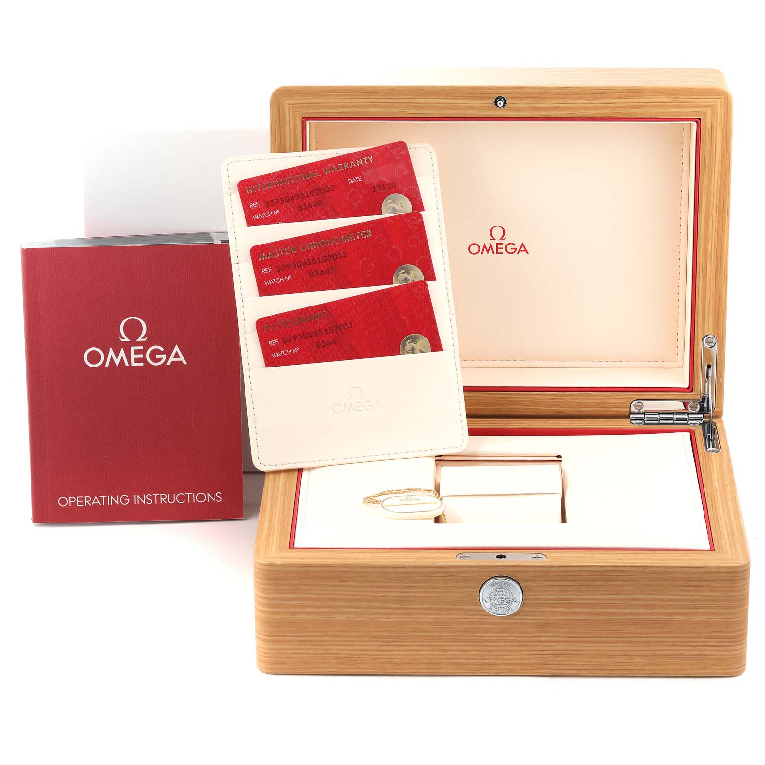 The image shows the packaging of the Omega Speedmaster 329.30.43.51.02.002 Men's Stainless Steel Silver Dial 329.30.43.51.02.002 Men's Stainless Steel Silver Dial watch with an open wooden box, operating instructions, and warranty cards.