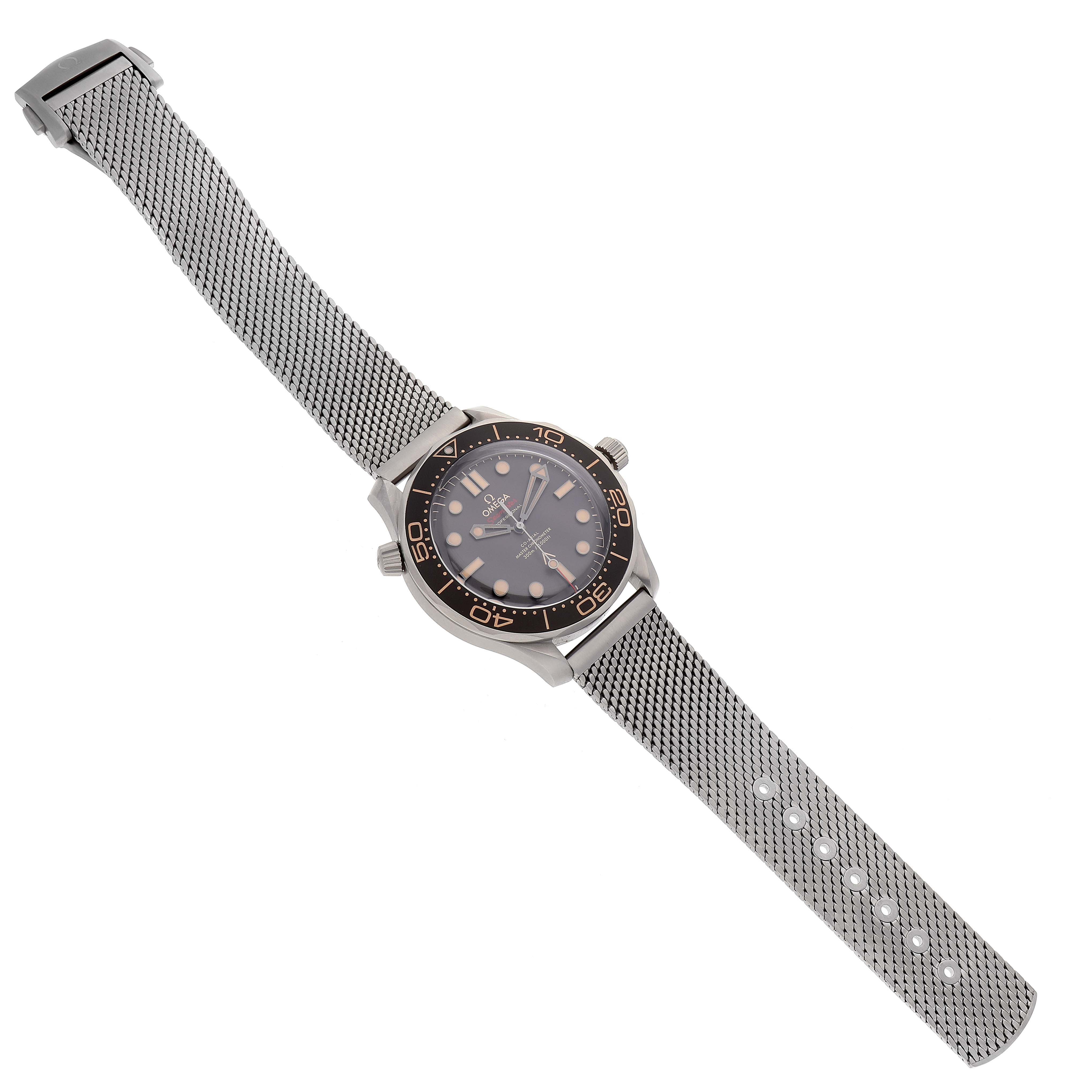 The Omega Seamaster 210.90.42.20.01.001 Men's Titanium Brown Dial 210.90.42.20.01.001 Men's Titanium Brown Dial watch is shown at a top-down angle, displaying its face, bezel, crown, and mesh bracelet.