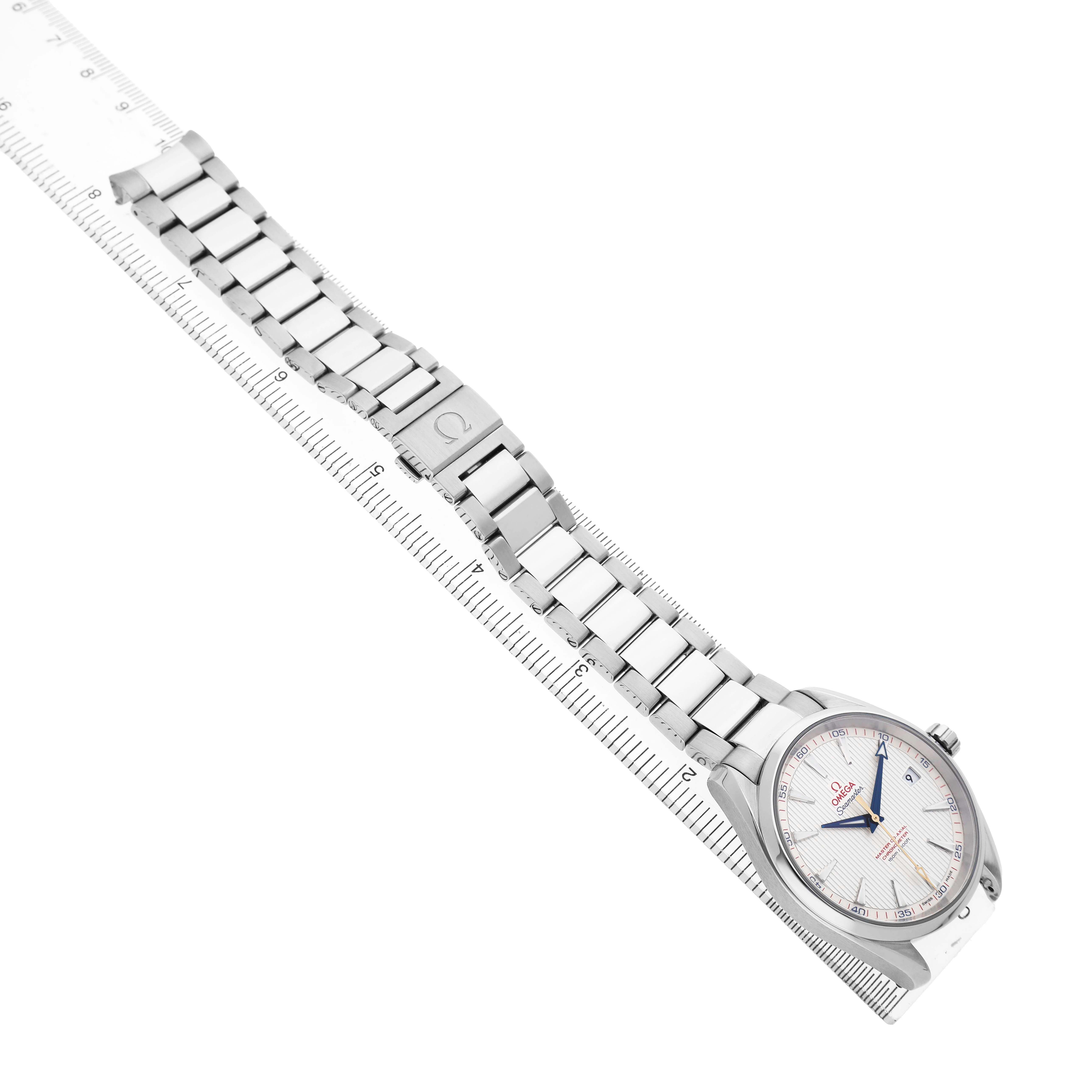The Omega Aqua Terra 231.10.42.21.02.004 Men's Stainless Steel Silver Dial watch is shown from a top angle, displaying the face and full metal bracelet along a ruler.