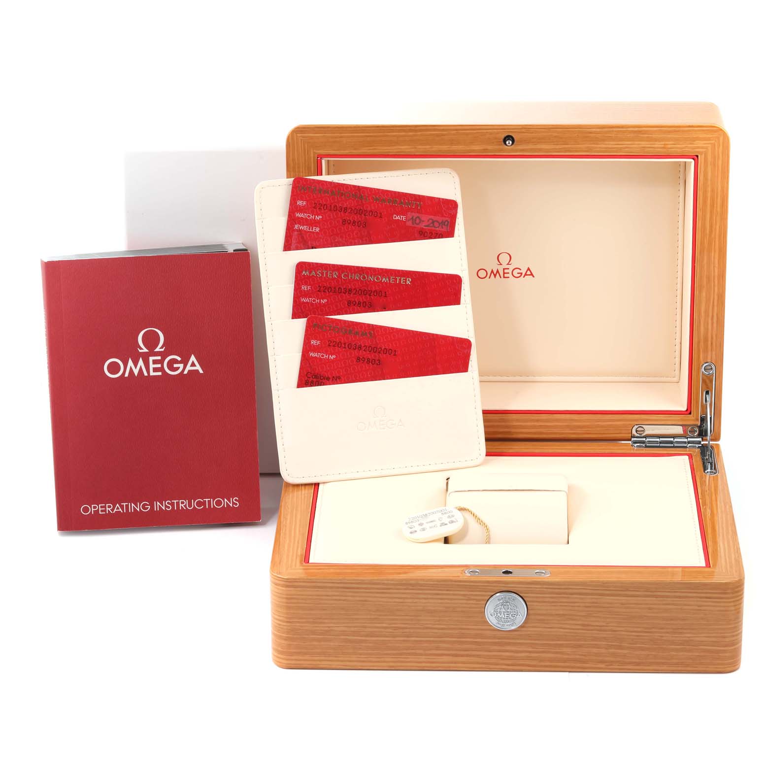 The image shows an Omega Aqua Terra 220.10.38.20.02.001 Men
s Stainless Steel Silver Dial 220.10.38.20.02.001 Men
s Stainless Steel Silver Dial watch box, warranty cards, and an operating instructions booklet.