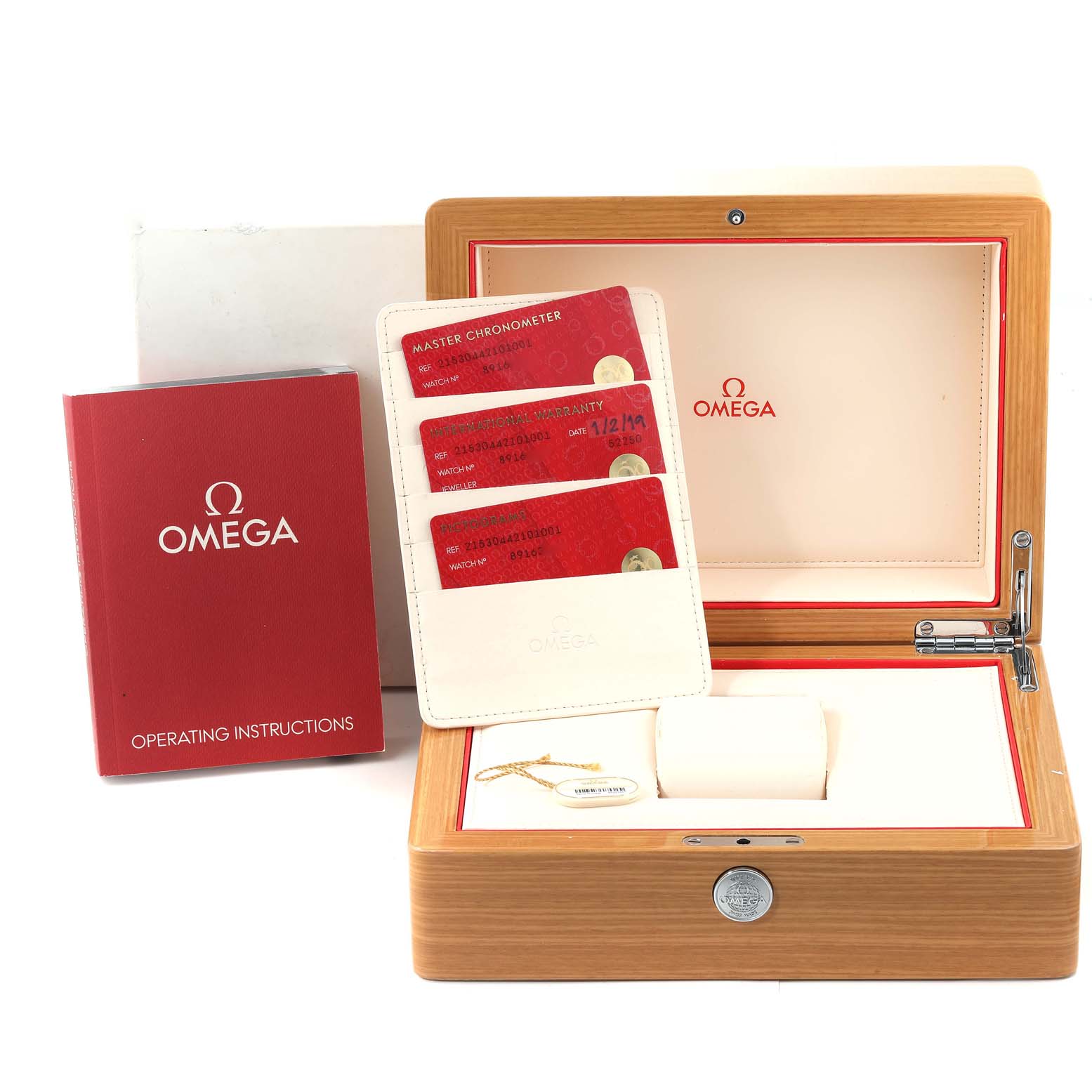 The image shows an Omega Planet Ocean 215.30.44.21.01.001 Men
s Stainless Steel Black Dial 215.30.44.21.01.001 Men
s Stainless Steel Black Dial watch box with warranty cards, an operating instructions booklet, and a watch holder.