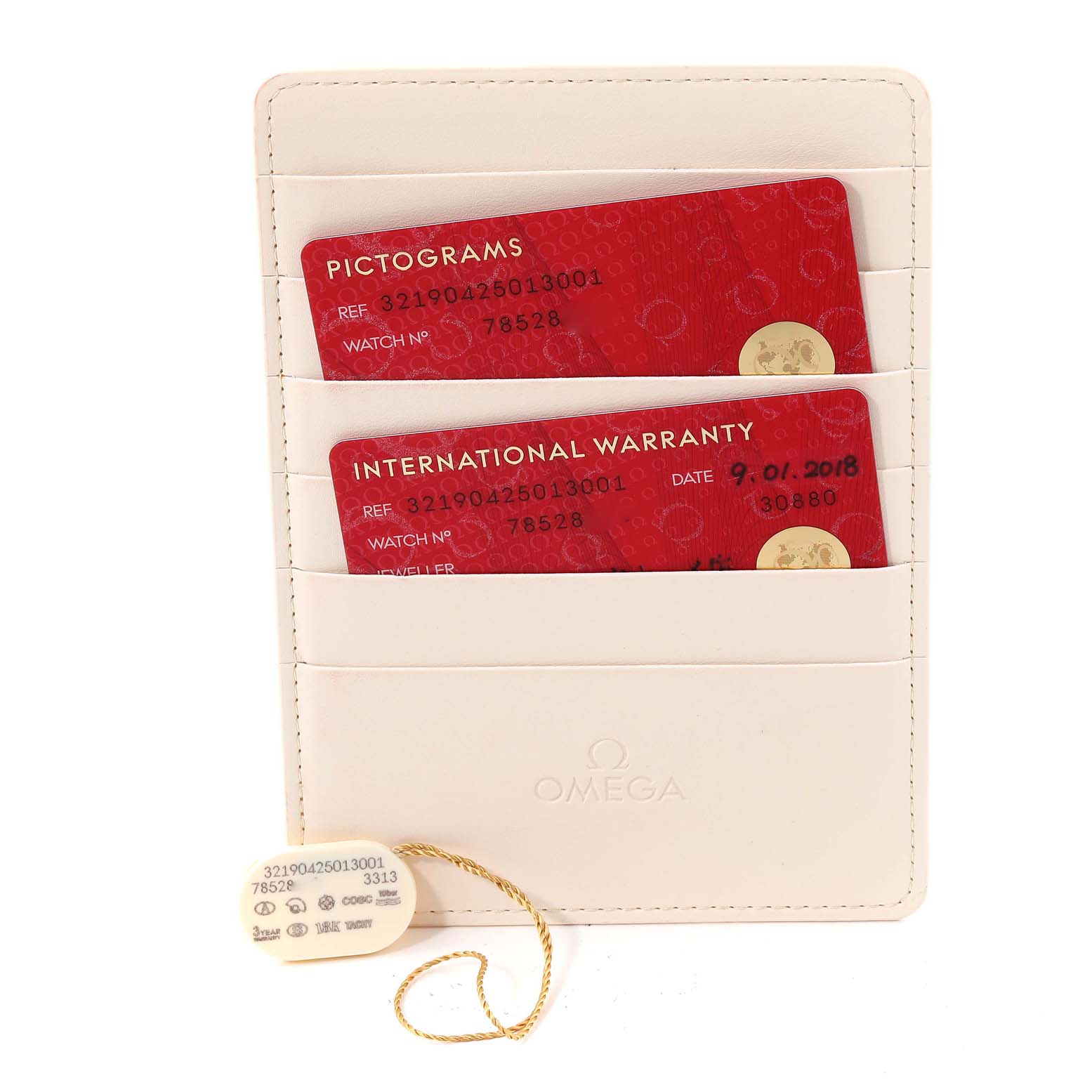 The image shows warranty cards and a tag for the Omega Speedmaster 321.90.42.50.13.001 Men's Steel and Gold (two tone) Brown Dial 321.90.42.50.13.001 Men's Steel and Gold (two tone) Brown Dial watch, held in a white Omega cardholder.