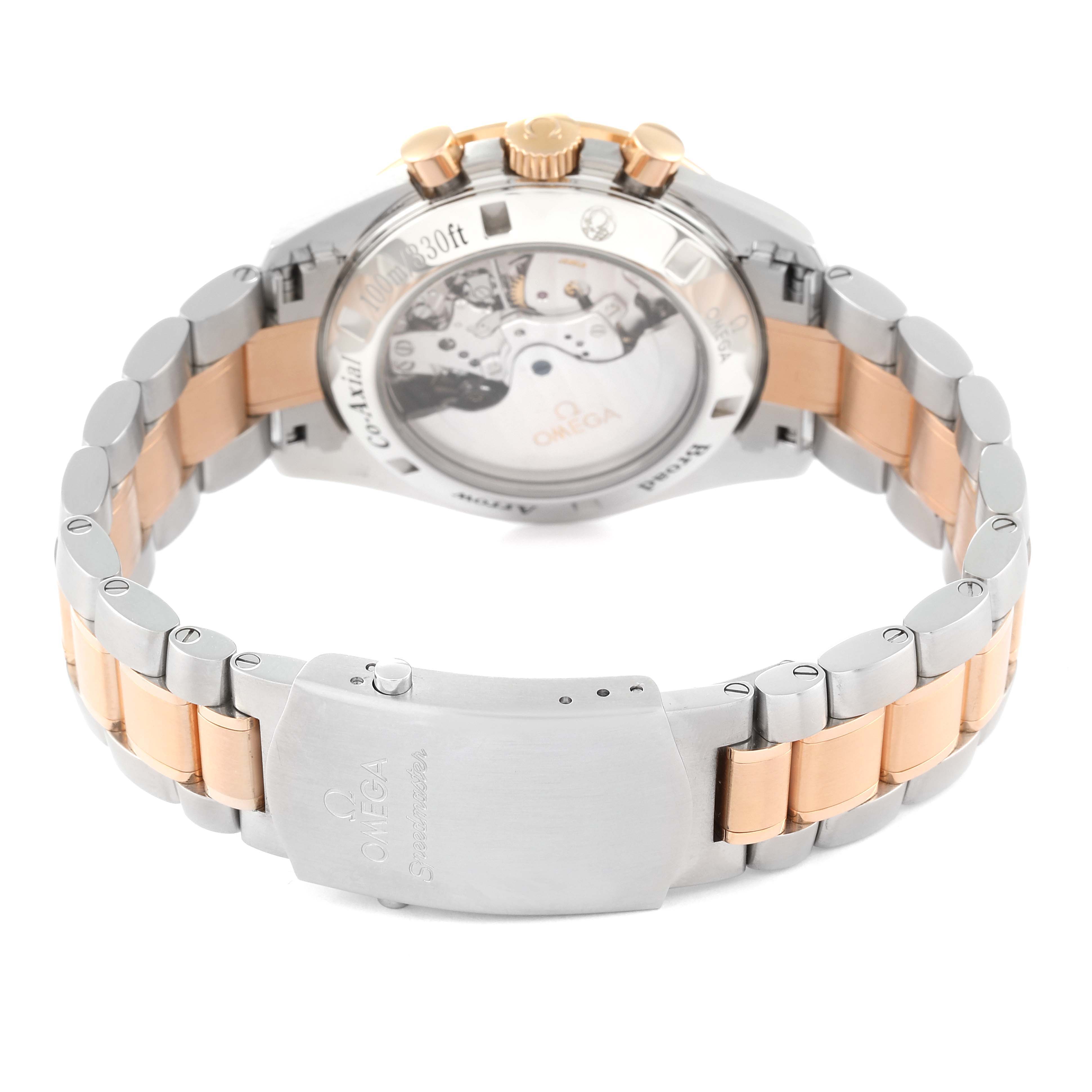 The image shows the back and clasp of an Omega Speedmaster 321.90.42.50.13.001 Men's Steel and Gold (two tone) Brown Dial 321.90.42.50.13.001 Men's Steel and Gold (two tone) Brown Dial watch, emphasizing its two-tone bracelet and visible movement.