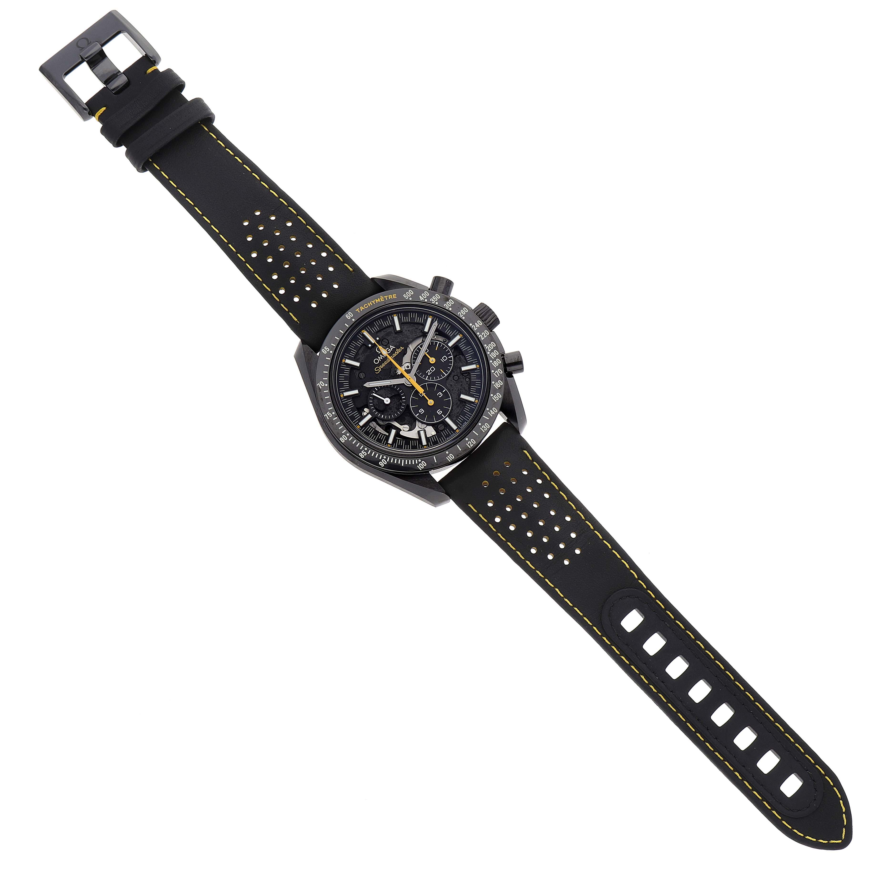 The image shows an overhead view of an Omega Speedmaster 311.92.44.30.01.001 Men
s Ceramic Black Dial 311.92.44.30.01.001 Men
s Ceramic Black Dial watch, displaying the dial, case, and perforated strap.