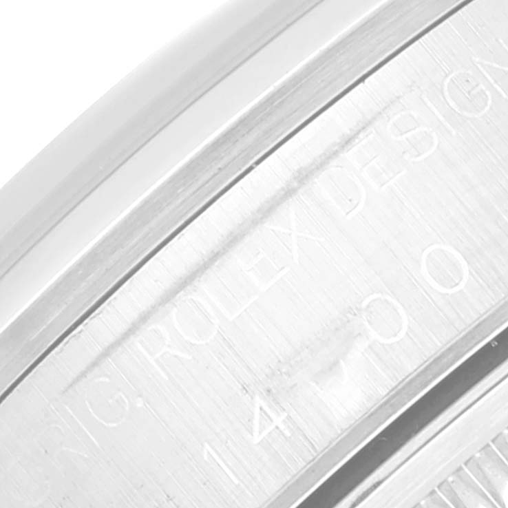 This close-up image shows the engraved text on the inner bezel of the Rolex Air-King 14000 Men's Stainless Steel Pink Dial 14000 Men's Stainless Steel Pink Dial watch.
