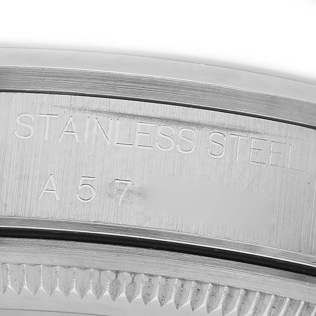 The image shows a close-up of the stainless steel case side and edge of the bezel of a Rolex Air-King 14000 Men's Stainless Steel Black Dial watch.