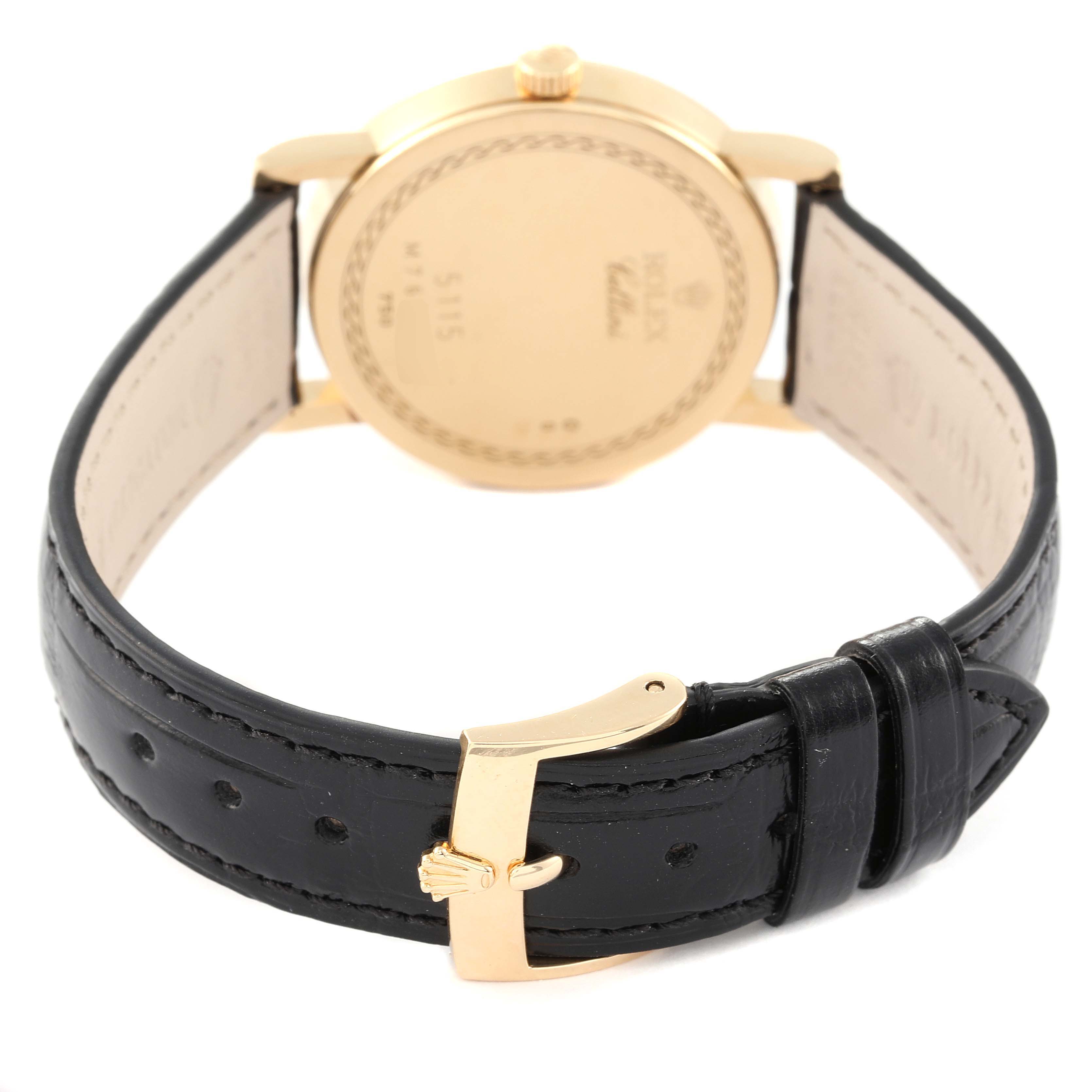 This image shows the back view of a Rolex Cellini 5115 Men's Yellow Gold Silver Dial 5115 Men's Yellow Gold Silver Dial watch, focusing on the clasp and leather strap.