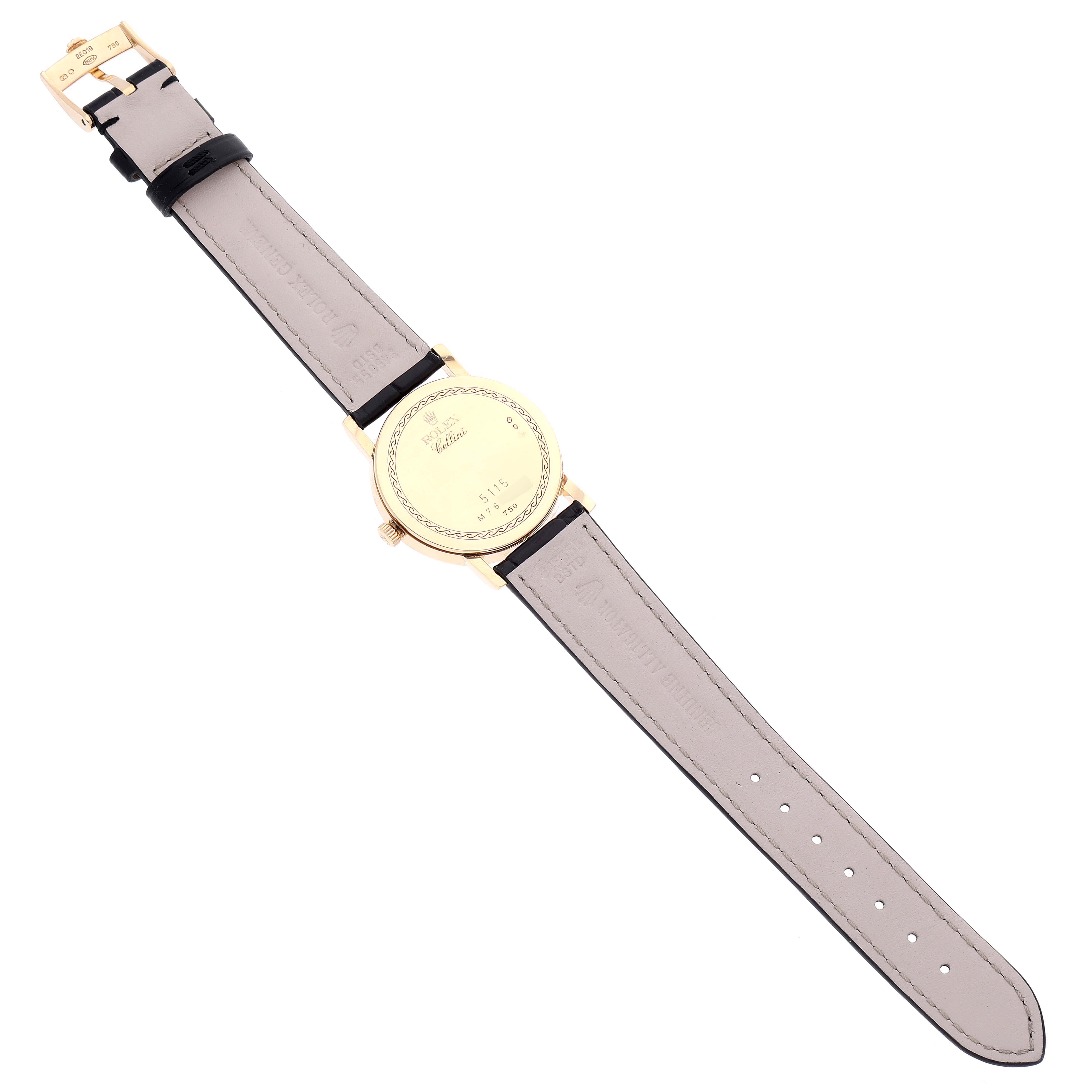 This image shows the back side of a Rolex Cellini 5115 Men's Yellow Gold Silver Dial 5115 Men's Yellow Gold Silver Dial watch, highlighting the gold case back, crown, and leather straps.