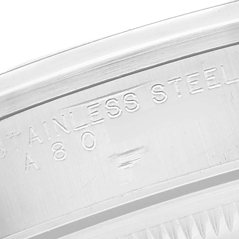 The close-up image shows the edge of the case back with the "Stainless Steel" engraving on a Rolex Date 15200 Men's Stainless Steel Black Dial 15200 Men's Stainless Steel Black Dial model watch.