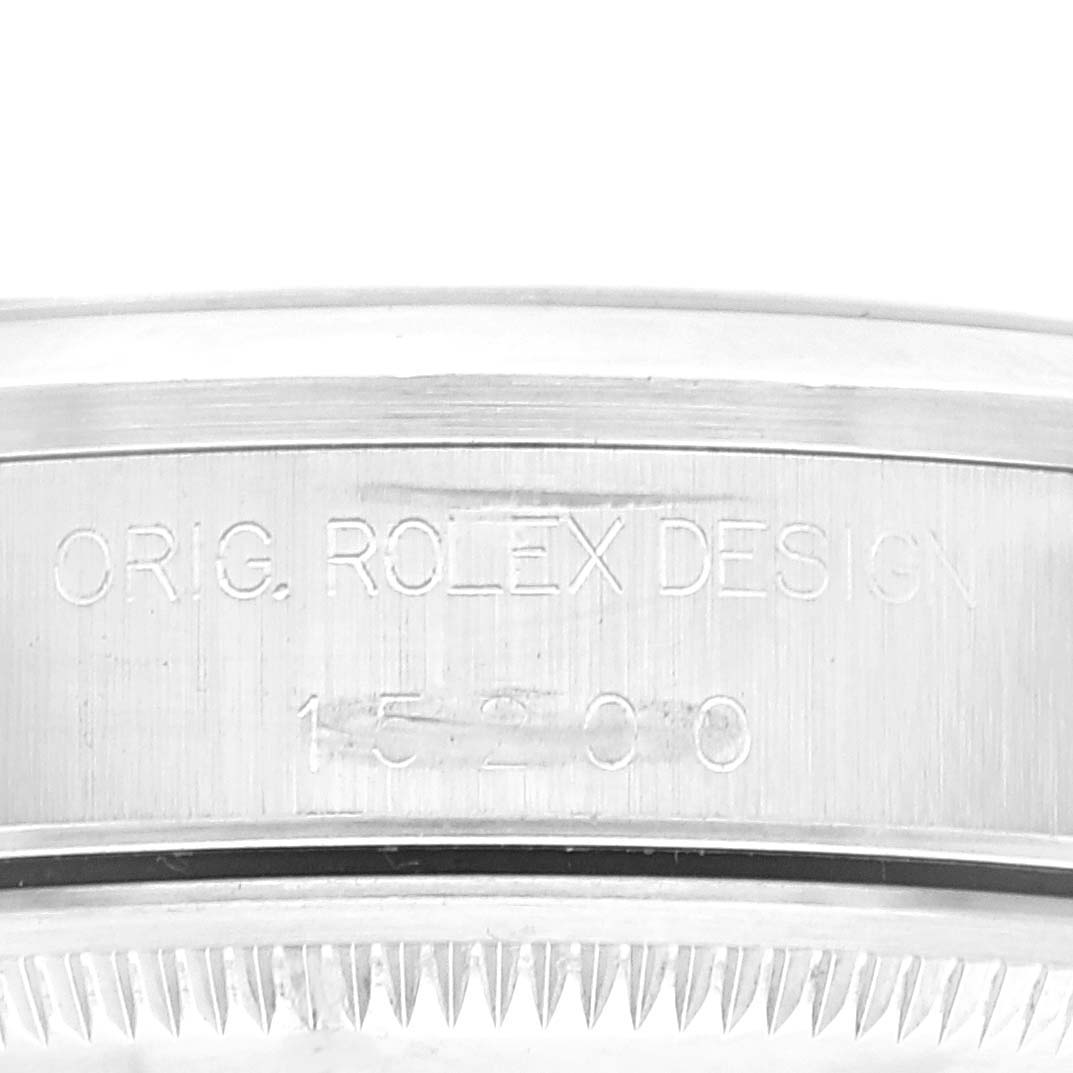 The image shows a close-up of the side engraving on a Rolex Date 15200 Men's Stainless Steel Blue Dial 15200 Men's Stainless Steel Blue Dial model watch bezel.