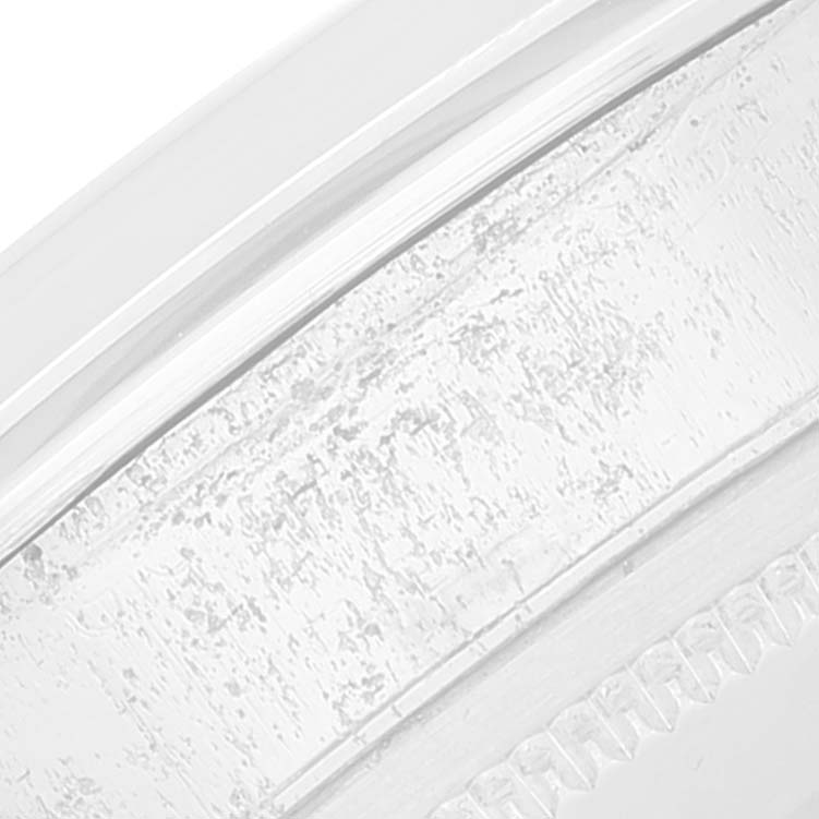 This close-up image shows the textured bezel of the Rolex Vintage Collection 1500 Men
s Stainless Steel Black Dial 1500 Men
s Stainless Steel Black Dial watch.