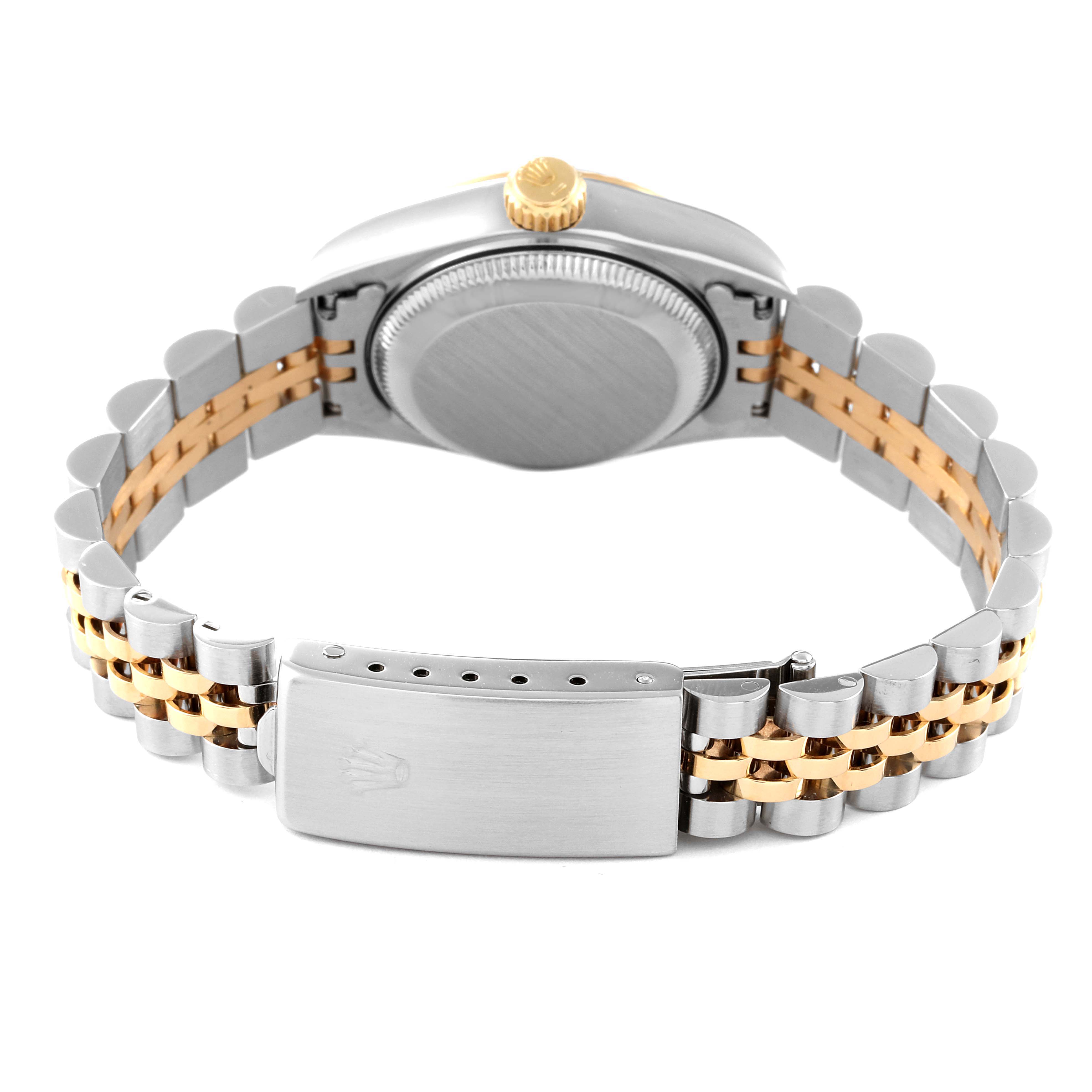 The image shows the back view of a Rolex Date 69173 Women's Steel and Gold (two tone) Silver Dial 69173 Women's Steel and Gold (two tone) Silver Dial model watch, highlighting the clasp, case back, and mixed metal bracelet.