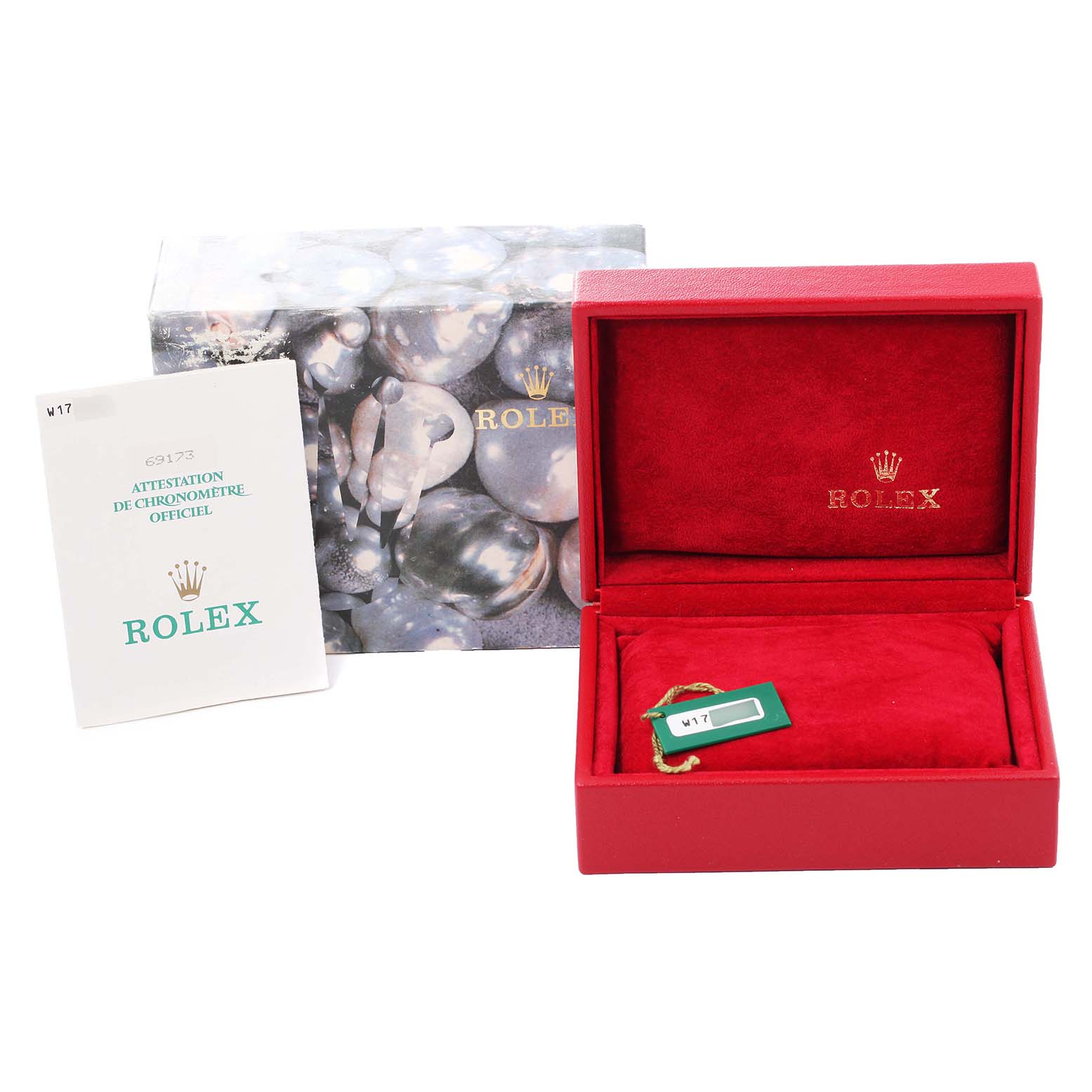 This image shows the packaging, warranty card, and box for a Rolex Datejust 69173 Women's Steel and Gold (two tone) Champagne Dial 69173 Women's Steel and Gold (two tone) Champagne Dial watch.