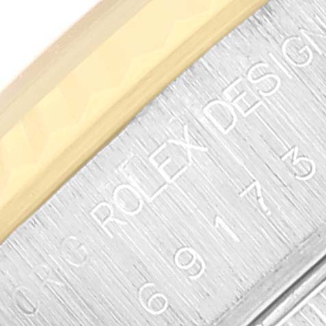 The image shows a close-up of the case side of a Rolex Datejust 69173 Women's Steel and Gold (two tone) Champagne Dial 69173 Women's Steel and Gold (two tone) Champagne Dial watch, highlighting the engraved "ROLEX DESIGN" text.