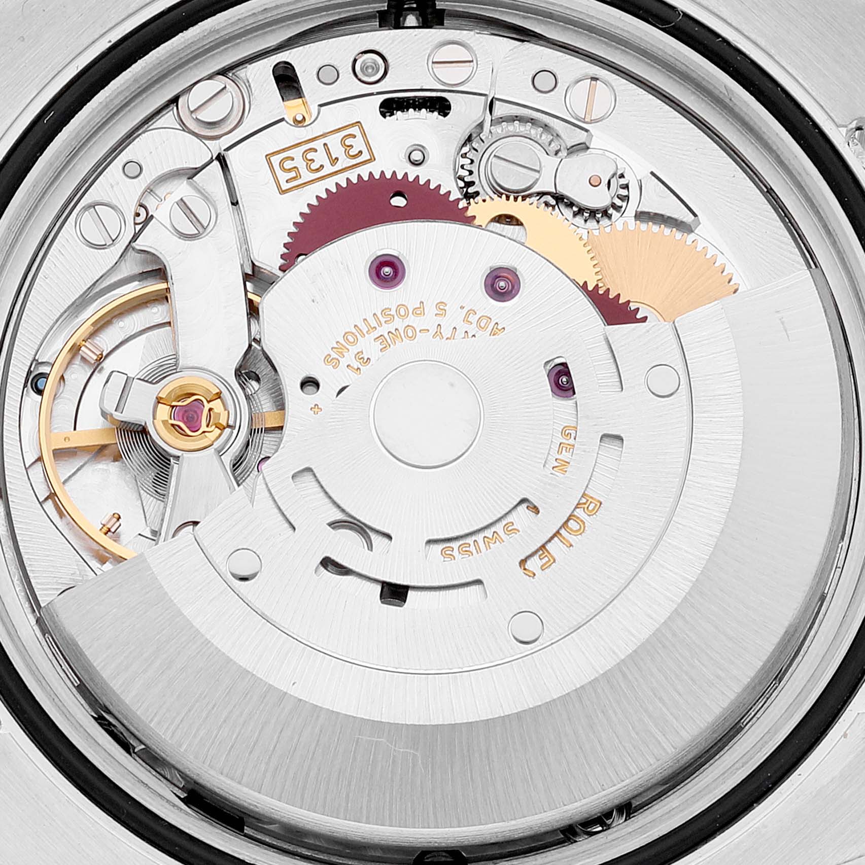 The image shows a close-up of the intricate movement and components inside a Rolex Datejust 116244 Men's Stainless Steel Black Dial 116244 Men's Stainless Steel Black Dial model watch.
