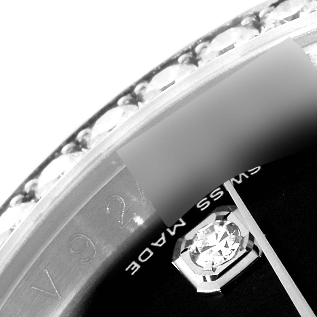 This close-up angle of the Rolex Datejust 116244 Men's Stainless Steel Black Dial 116244 Men's Stainless Steel Black Dial model shows the bezel with diamonds and part of the dial displaying a diamond hour marker.