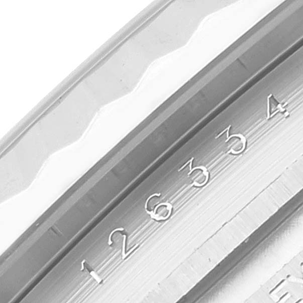 The image shows a close-up angle of the fluted bezel and part of the rehaut with engraved numerals of the Rolex Datejust 41 126334 Men's Stainless Steel White Dial 126334 Men's Stainless Steel White Dial model.