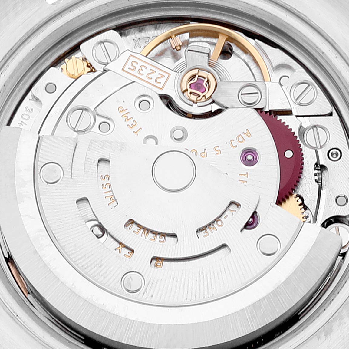 This image shows a close-up of the movement mechanism of a Rolex Datejust 179171 Women
s Steel and Gold (two tone) Pink Dial 179171 Women
s Steel and Gold (two tone) Pink Dial watch, including elements like the rotor and gear train.