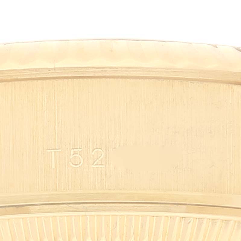 The image shows a close-up of the numeral engraving on the Rolex President 69178 Women's Yellow Gold Champagne Dial 69178 Women's Yellow Gold Champagne Dial watch band.