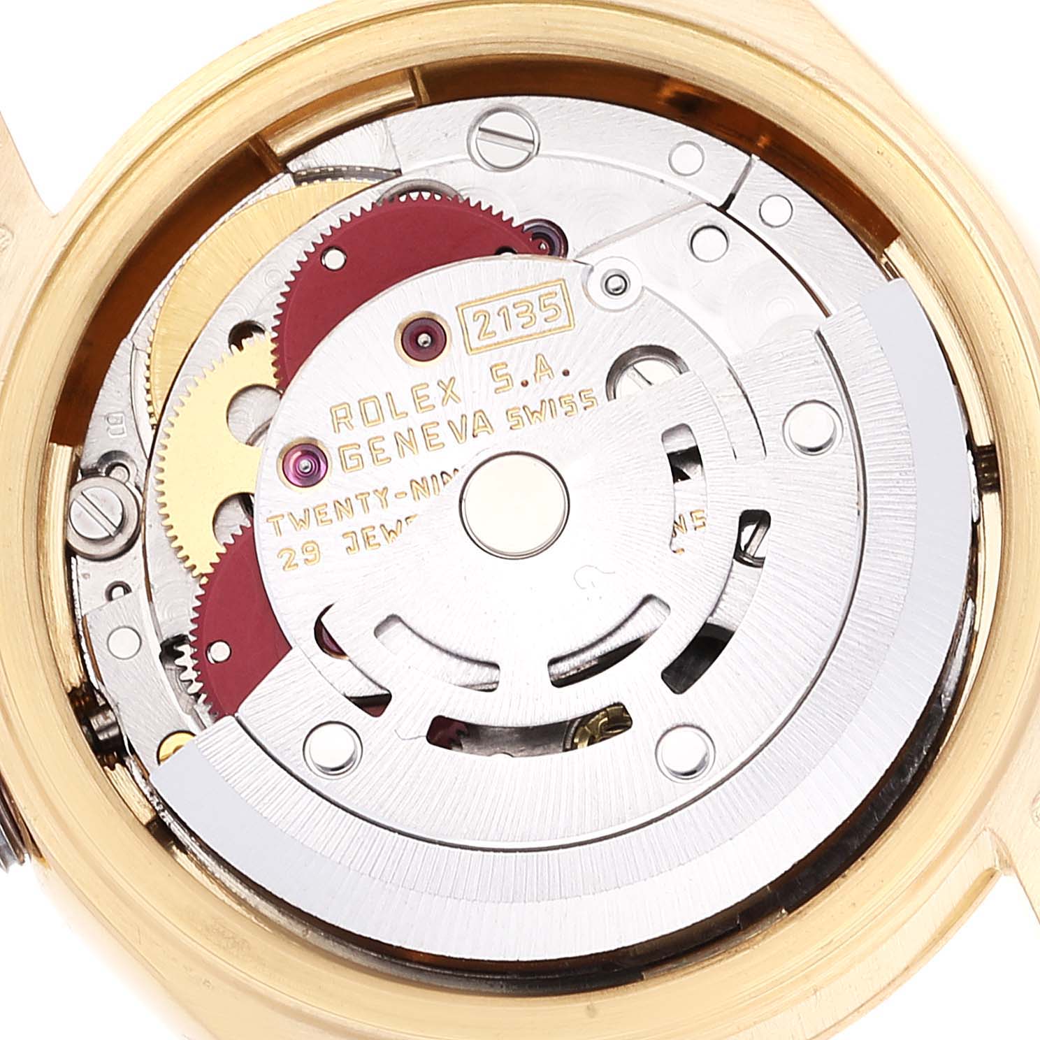 This image shows the intricate internal mechanism of the Rolex President 69178 Women's Yellow Gold Champagne Dial 69178 Women's Yellow Gold Champagne Dial model watch with gears and jewels visible.