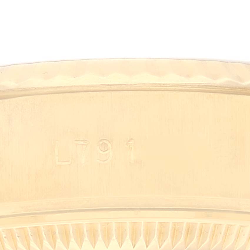 This image shows a close-up of the case side edge with markings on the Rolex President 69178 Women's Yellow Gold Champagne Dial 69178 Women's Yellow Gold Champagne Dial model watch.