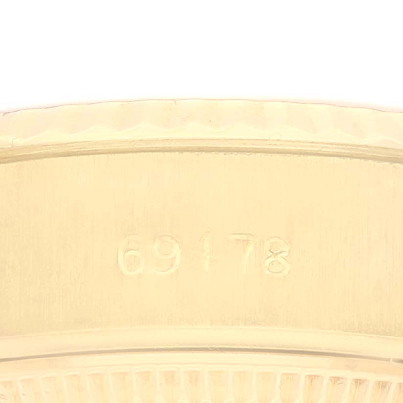 This close-up image shows the engraved model number (69178) on the case of a Rolex President 69178 Women's Yellow Gold Champagne Dial 69178 Women's Yellow Gold Champagne Dial watch.