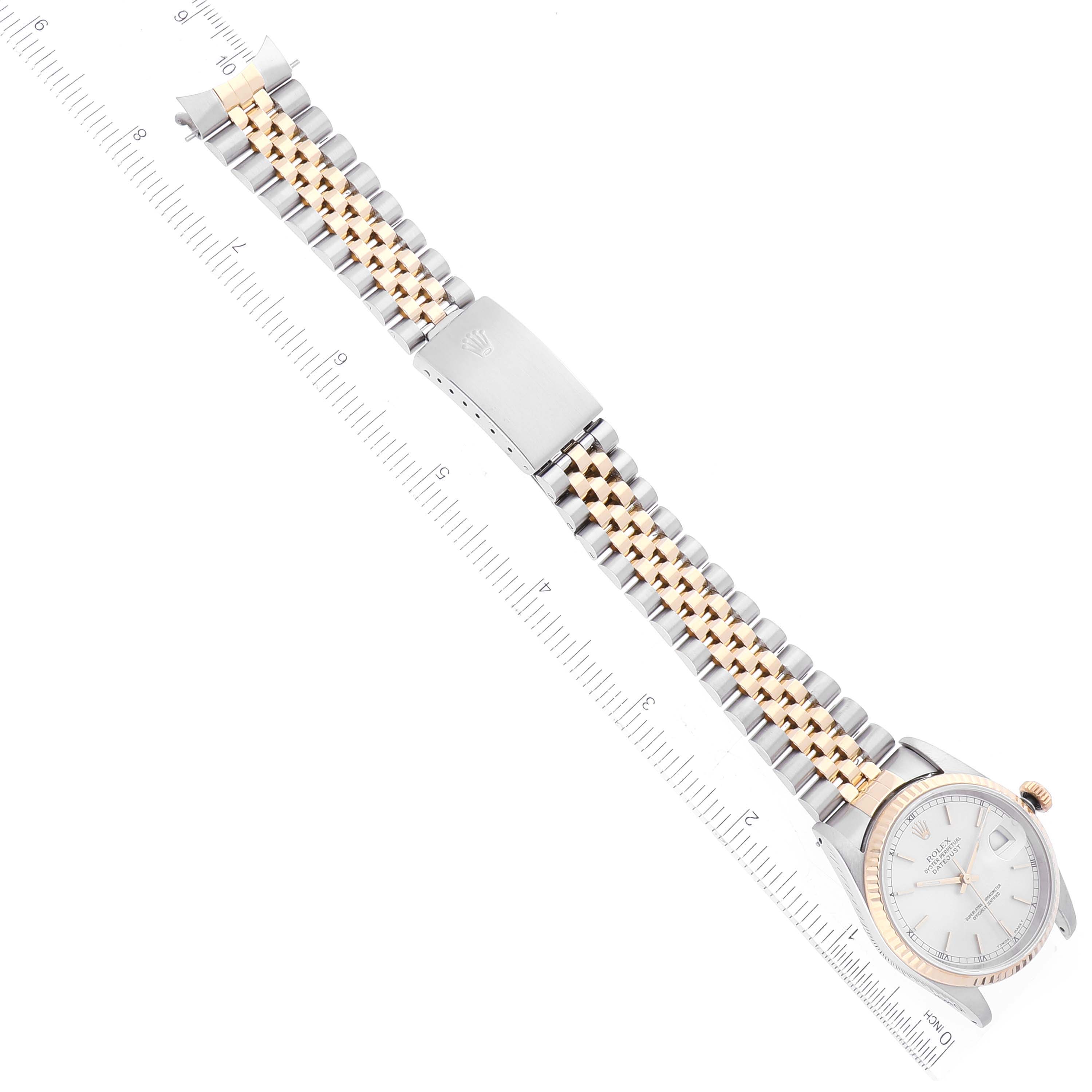 This image shows a top-down view of a Rolex Datejust 16233 Men's Steel and Gold (two tone) Silver Dial 16233 Men's Steel and Gold (two tone) Silver Dial watch, highlighting its two-tone bracelet and clasp.