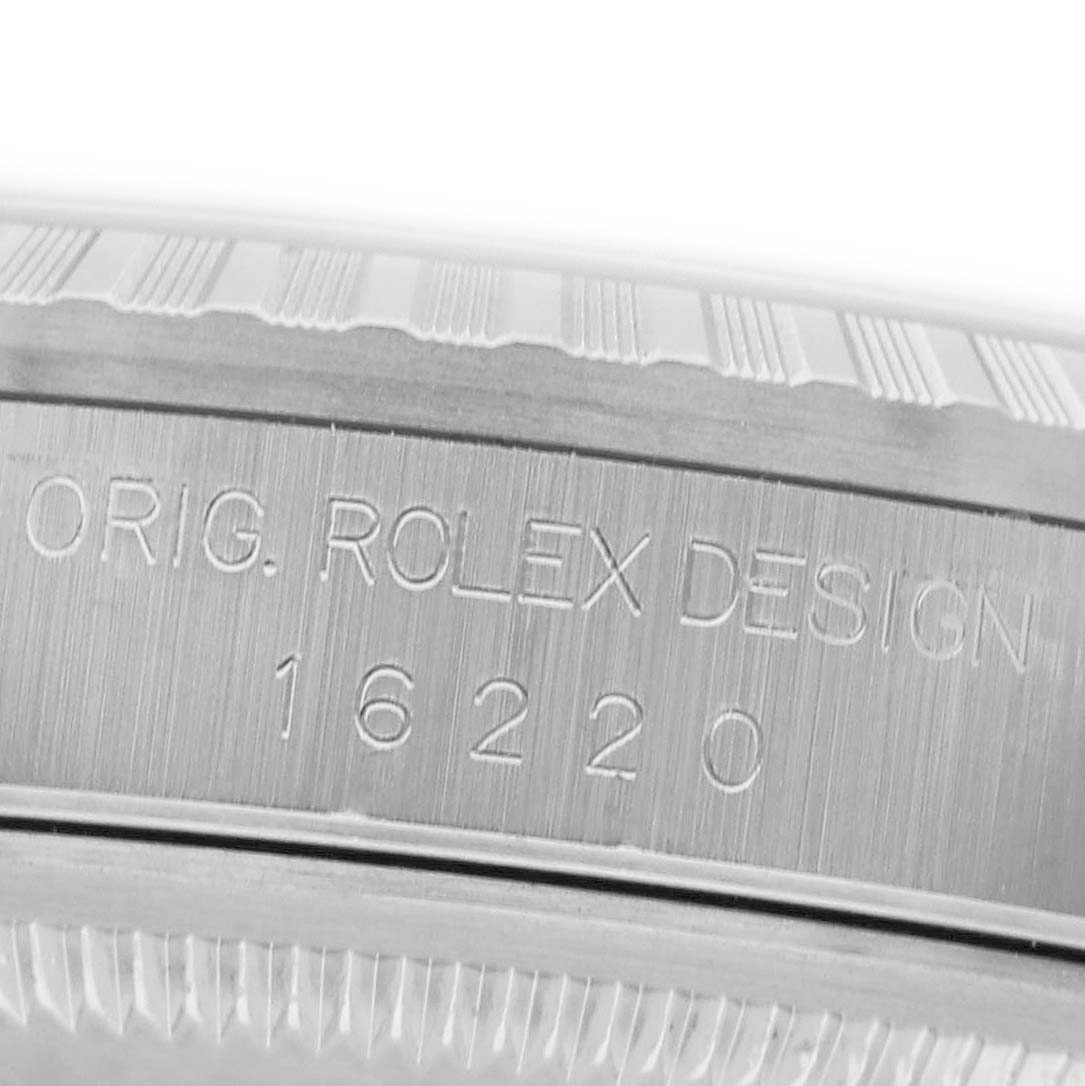 The image shows the side view of a Rolex Datejust 16220 Men's Stainless Steel Blue Dial model case, highlighting the "ORIG. ROLEX DESIGN" engraving and model number 16220.